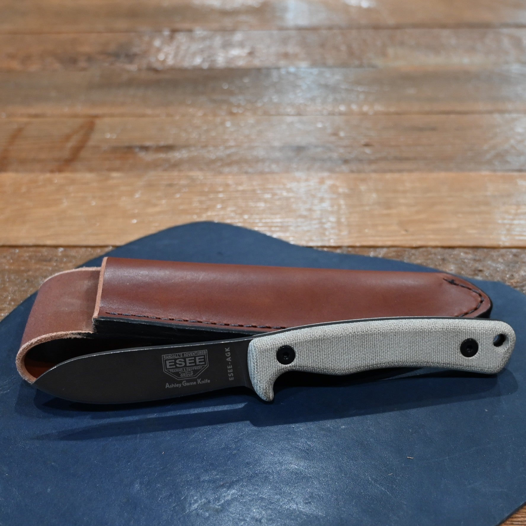 ESEE Ashley Emerson hunting knife with 1095 carbon steel blade and leather sheath, 2025 edition
