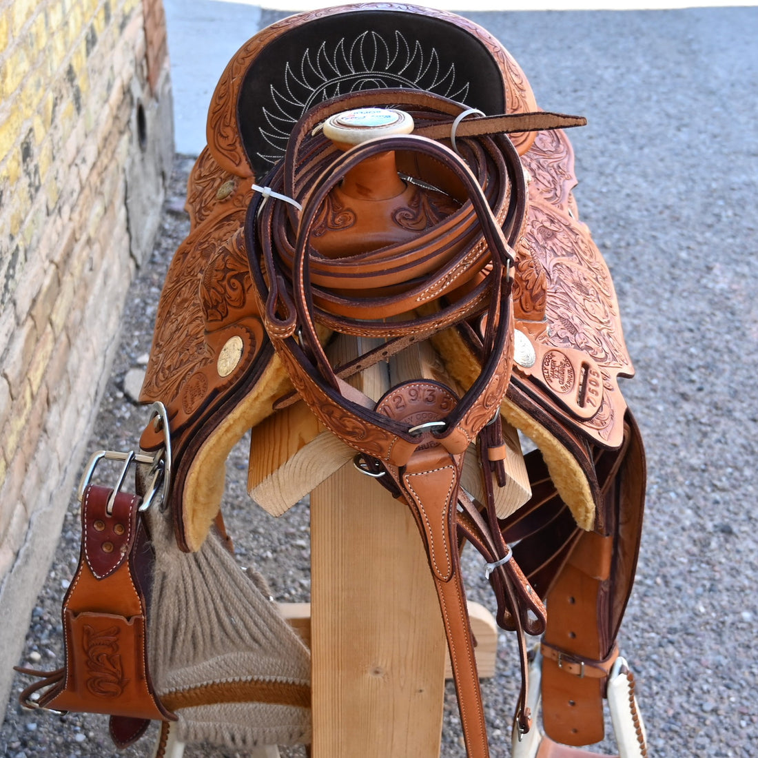 View of Billy Cook Fully Tooled Roper Saddle with Bridle, Breast Collar, and Reins