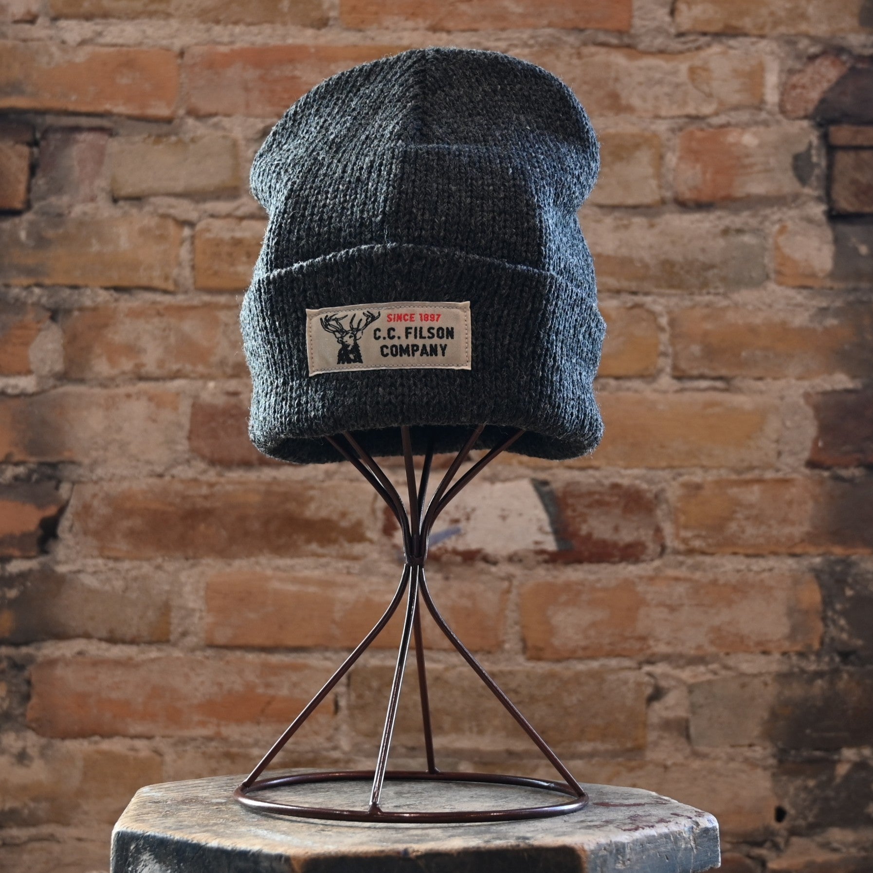 View of Filson Lined Ragg Wool Beanie in Charcoal featuring a cuffed design and classic logo label