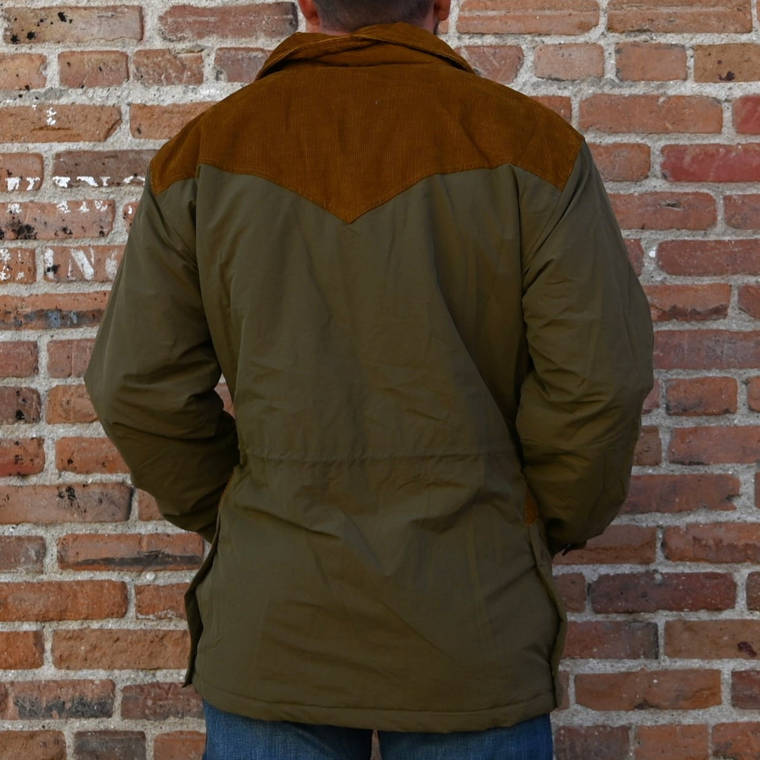 View of Schaefer Carson olive jacket with corduroy yoke and collar, quilted lining, and multiple utility pockets