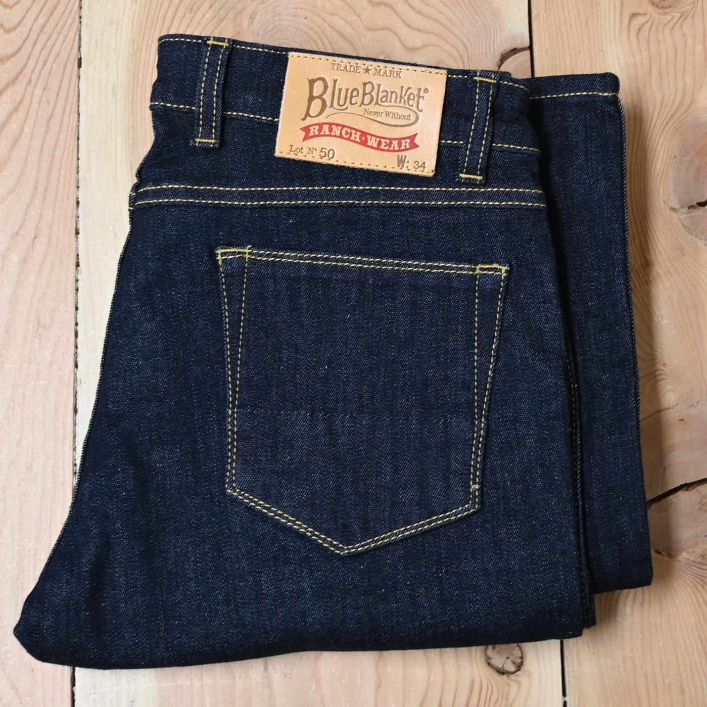 View of Blue Blanket ladies dark indigo denim jeans with straight-leg and tailored waist