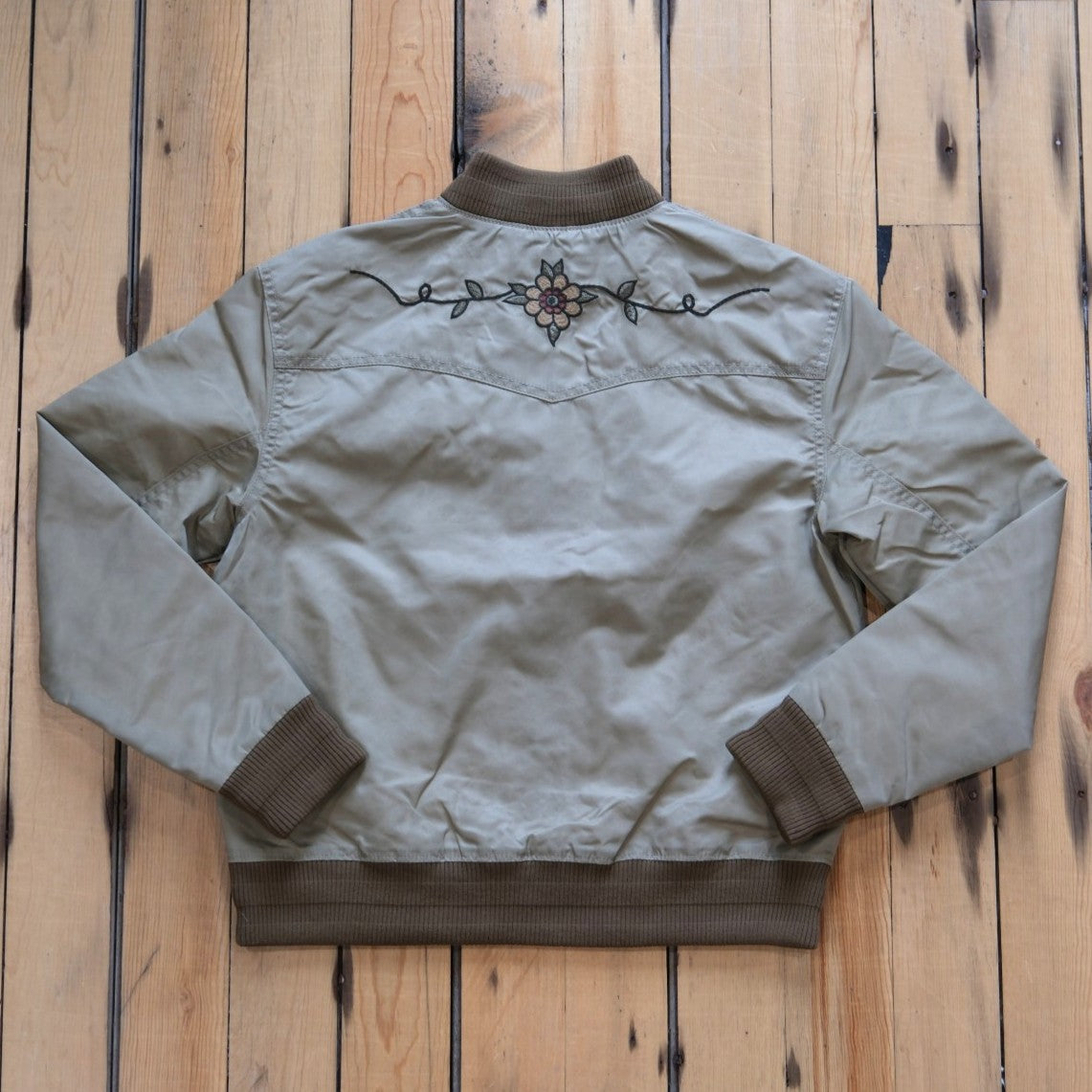 Filson Ladies Western Satin Jacket in Silver Sage featuring embroidered western yokes and a snap-front design.