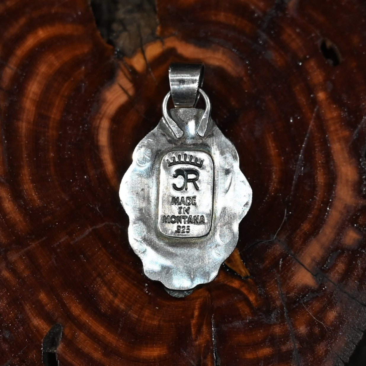 Calico Rose sterling silver pendant with White Buffalo turquoise stone featuring bold black-and-white veining