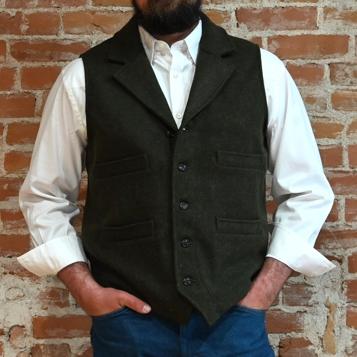 View of Filson Western Vest in Charcoal and Forest Green, showcasing its classic Western design and durable Mackinaw Wool construction