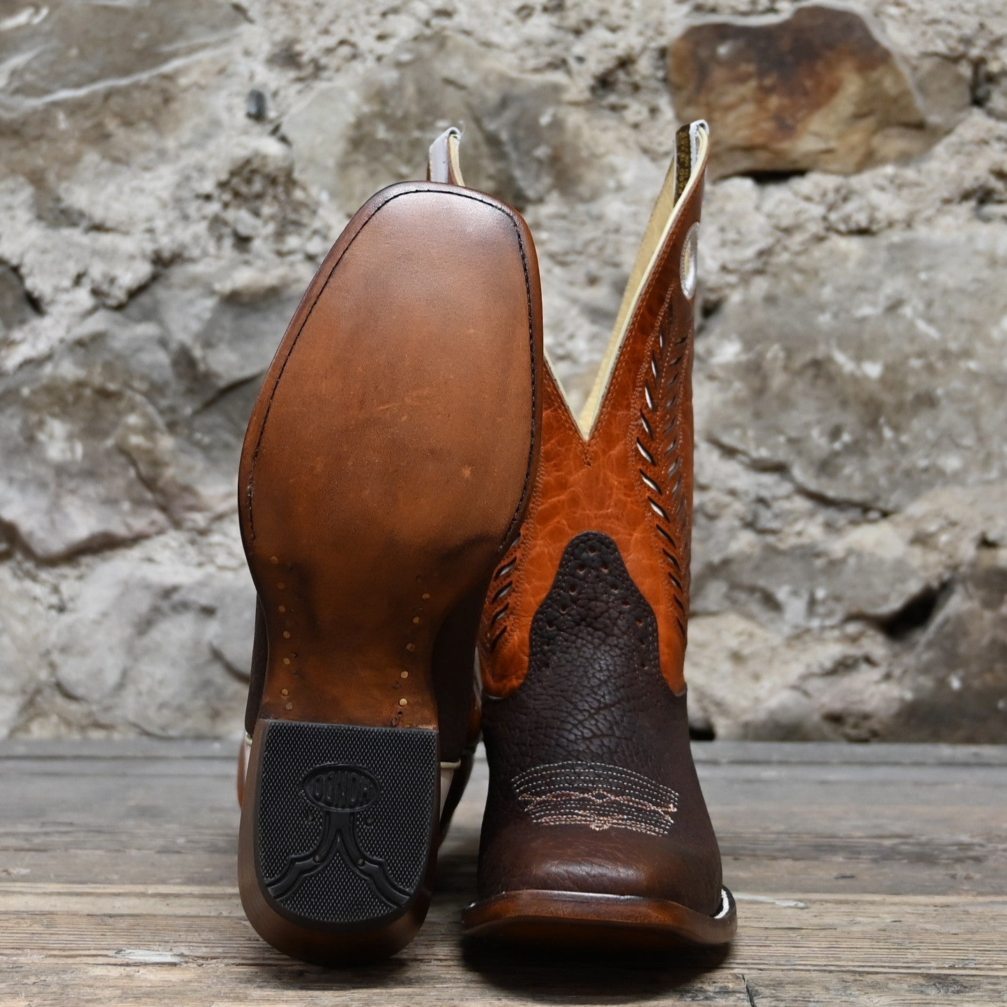 View of Hondo 12" bronc boot with mango volcano top, tobacco oiled bullhide vamp, and spur ledge