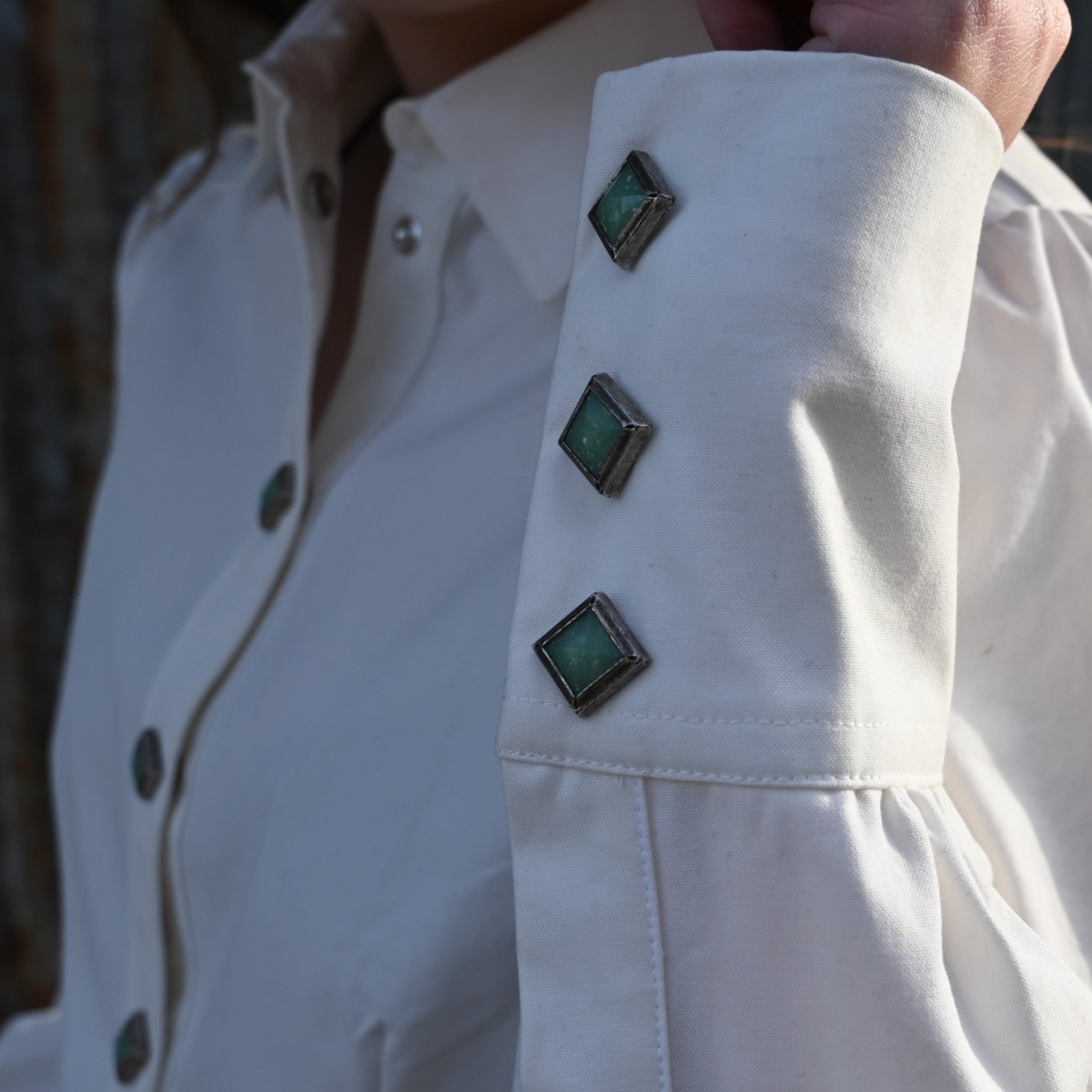 View of Blue Blanket ladies white Western cotton shirt with turquoise gem snaps and yoke detailing