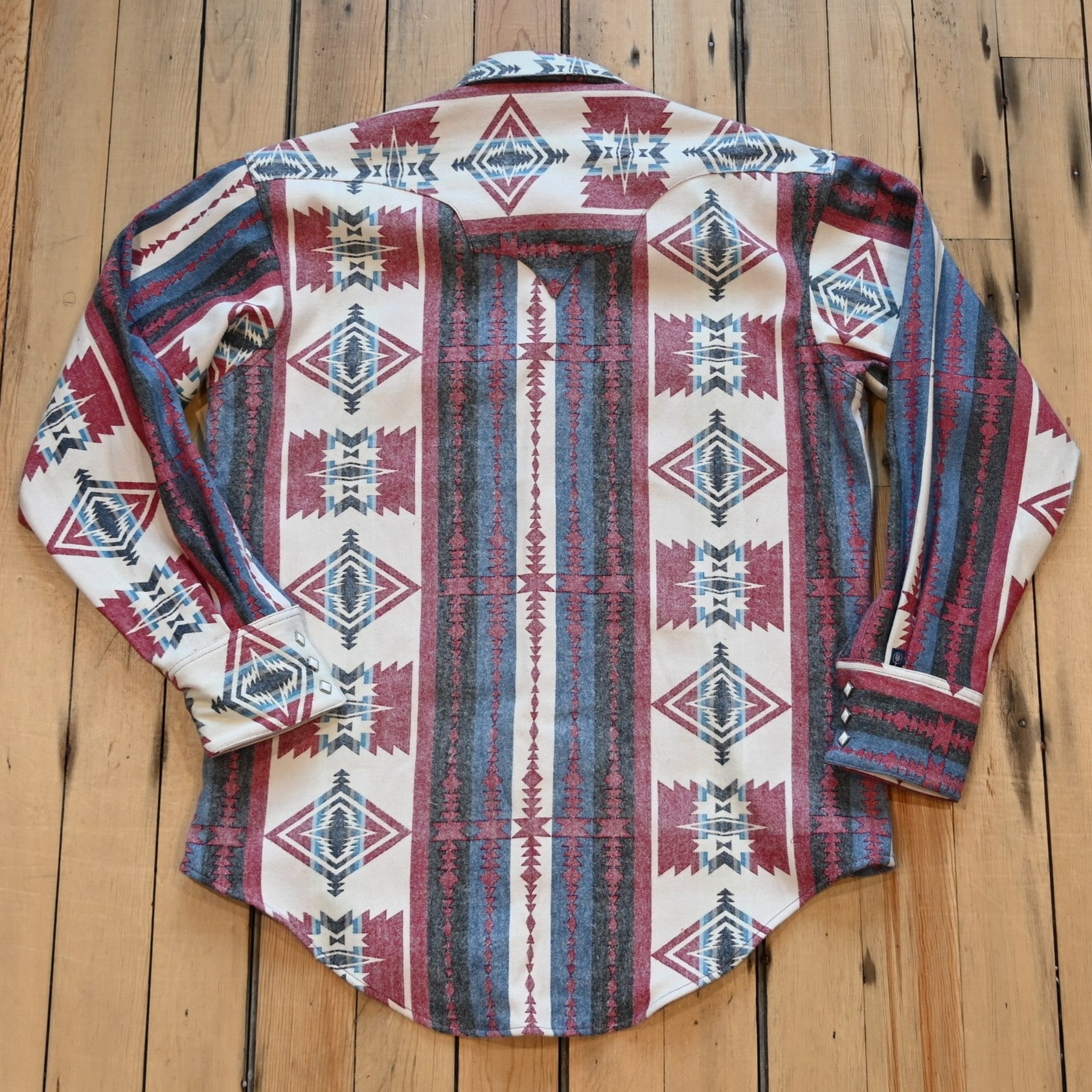 View of Rockmount men’s red and white premium flannel shirt with jacquard pattern and western snaps