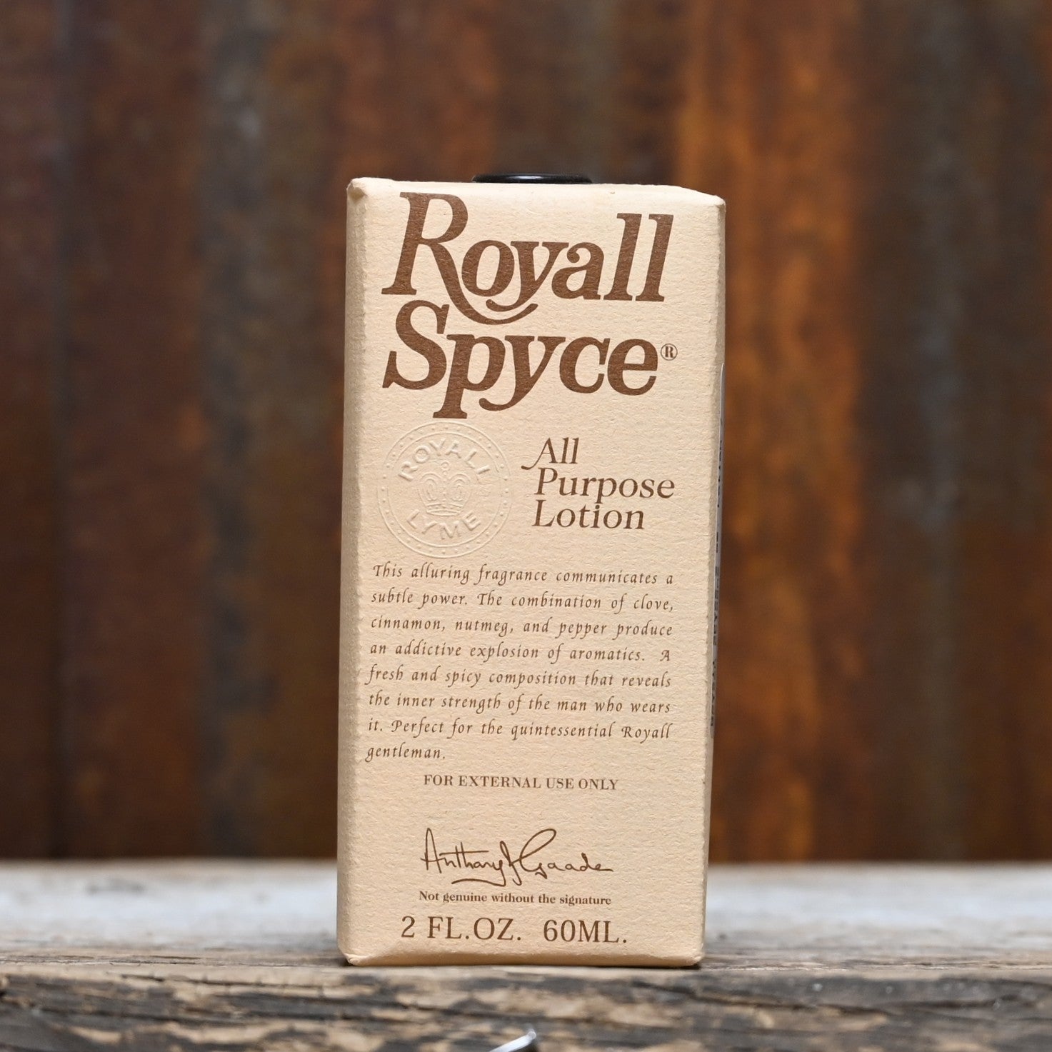 Royall Spyce 2 oz bottle of all-purpose lotion and splash cologne in amber glass with gold cap