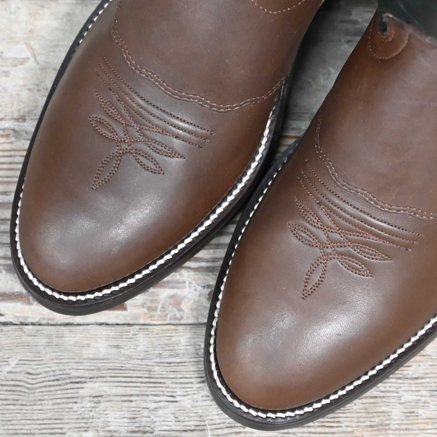 View of Hondo 16" cowboy boot with forest green top, brown retan vamp, pull holes, and spur ledge