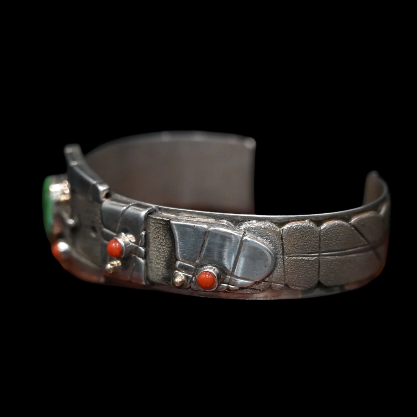 View of Sunwest Silver Carico Lake Turquoise Belt Cuff featuring a belt-like structure with a Carico Lake turquoise stone and spiny oyster stone dots set in sterling silver