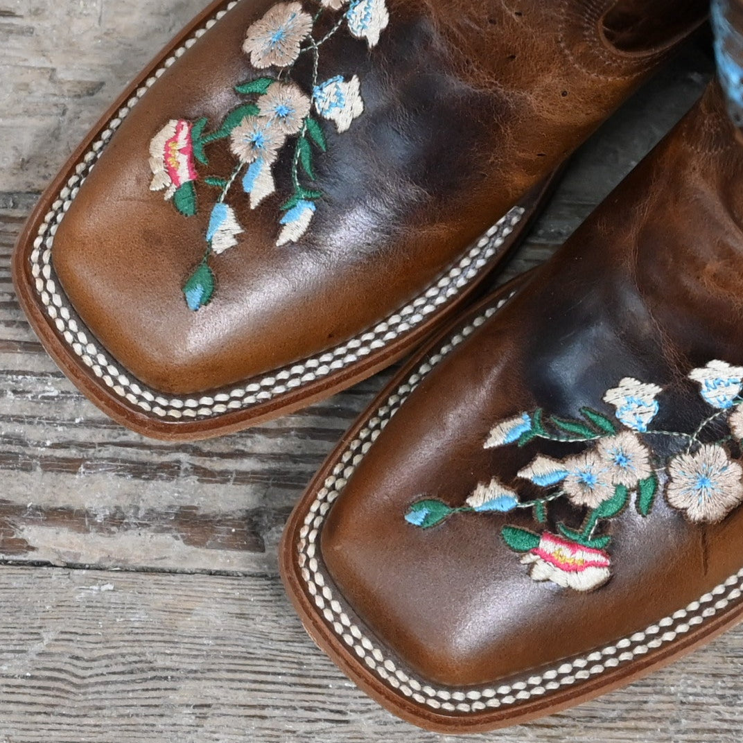 View of Macie Bean Kids Honey Bunch boot in honey leather with floral embroidery and square toe