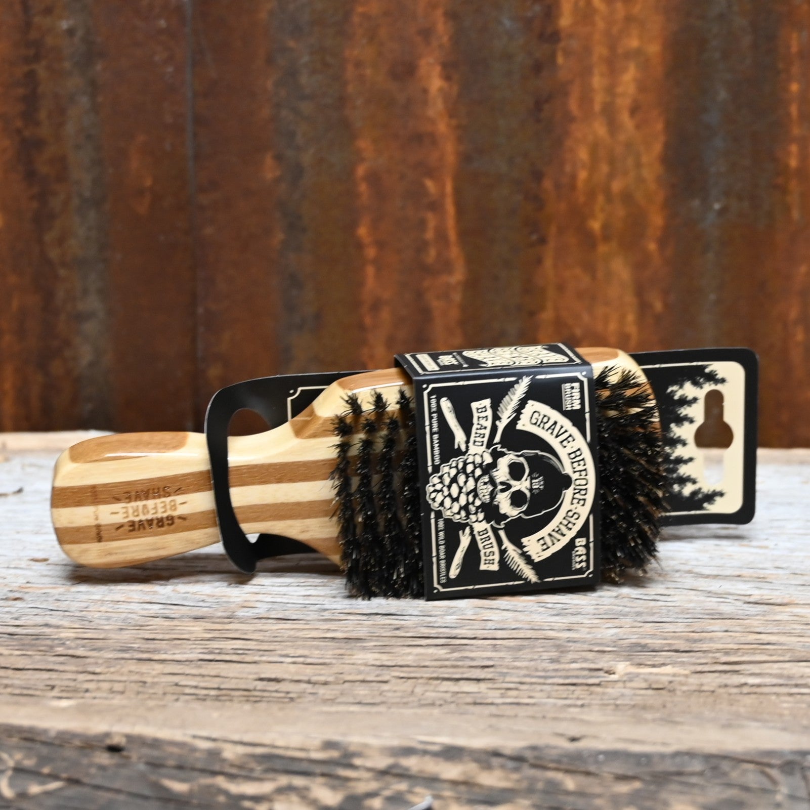 Grave Before Shave official beard brush with natural boar bristles and wood handle featuring logo engraving