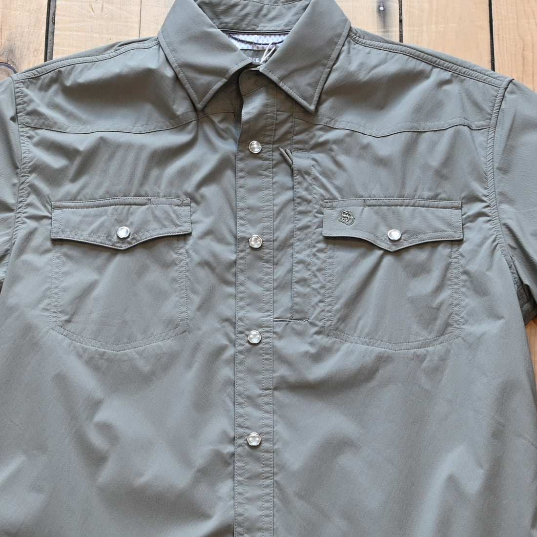 View of Schaefer men’s sage short‑sleeve RangeTek Western snap shirt with mesh vent and security pocket