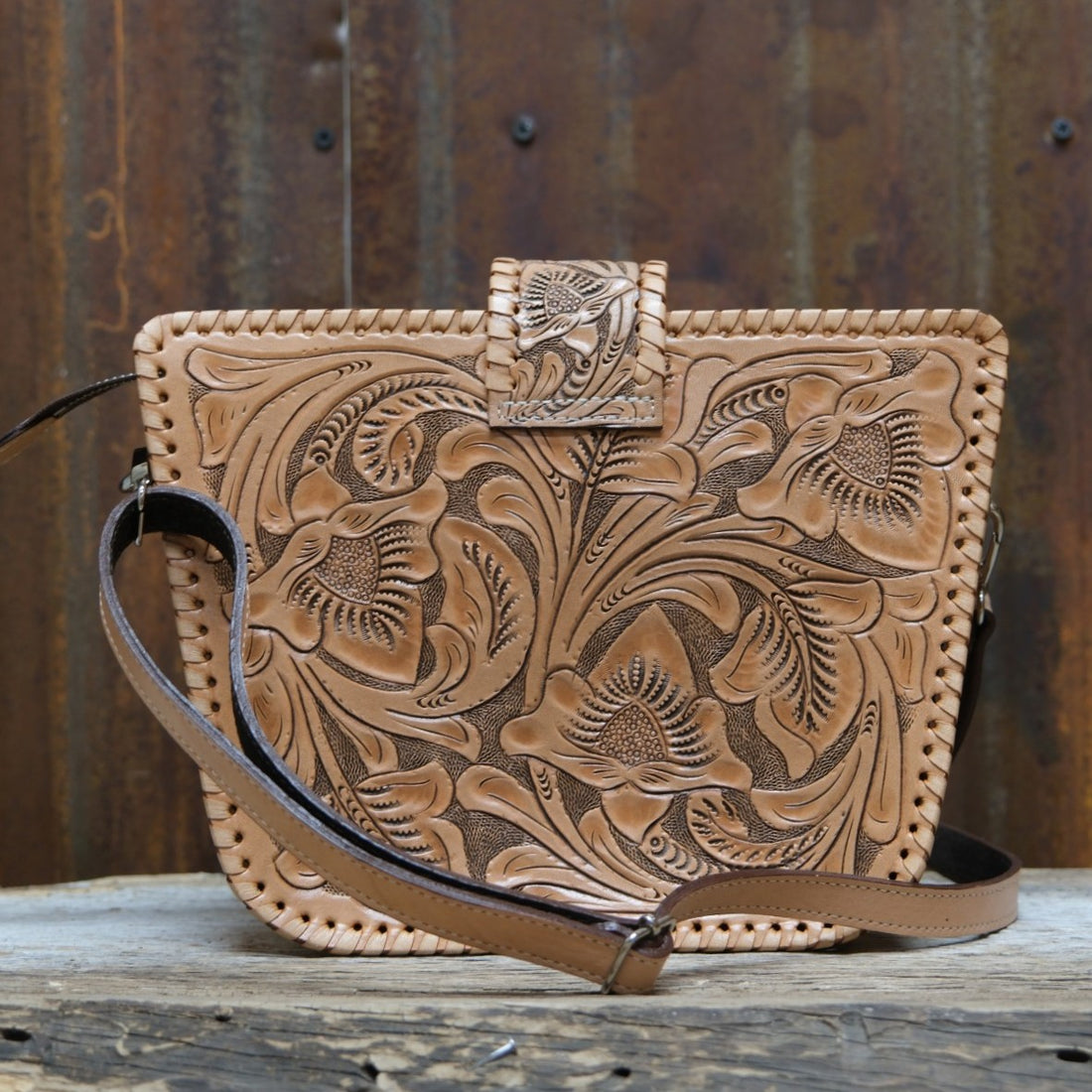 Que Chula natural tooled leather crossbody purse with floral carving and buckstitch edging