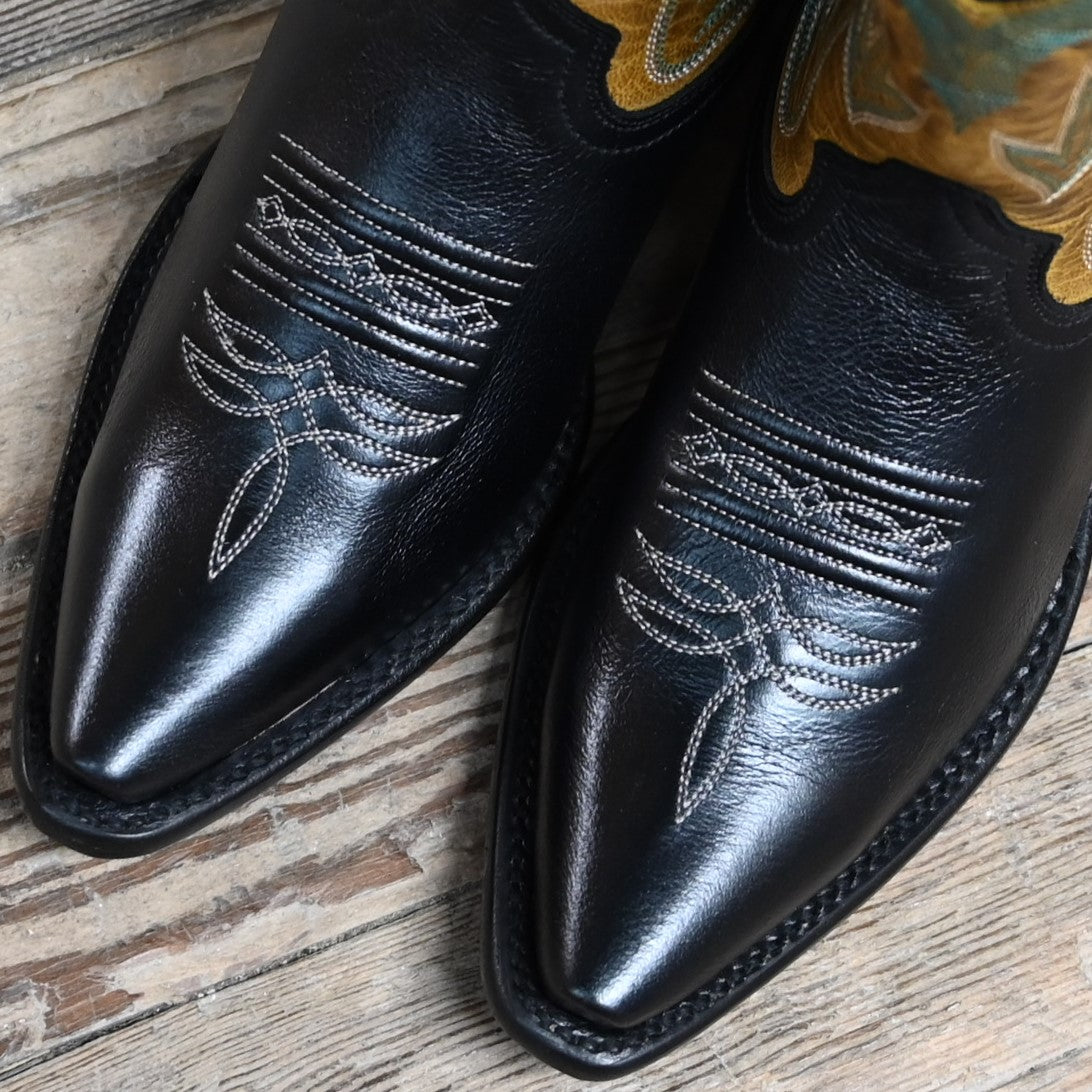 View of Hyer NANETTE 9" boots showcasing black cowhide vamp and sunflower vintage goat top with butterfly inlay, fashion snip toe, and leather stacked heel