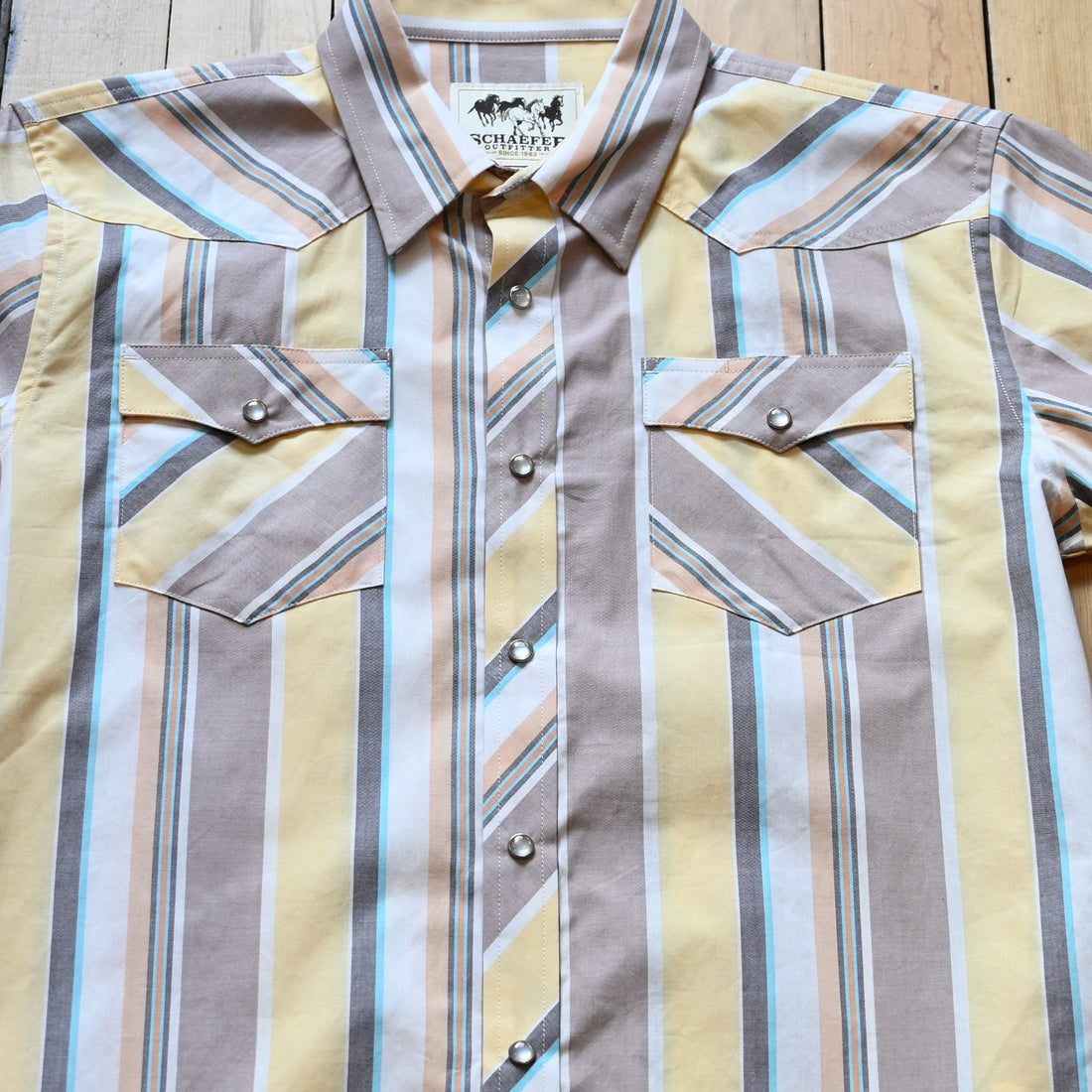 View of Short sleeve vintage cotton pearl snap shirt in Alamo with Western yoke and chest pockets