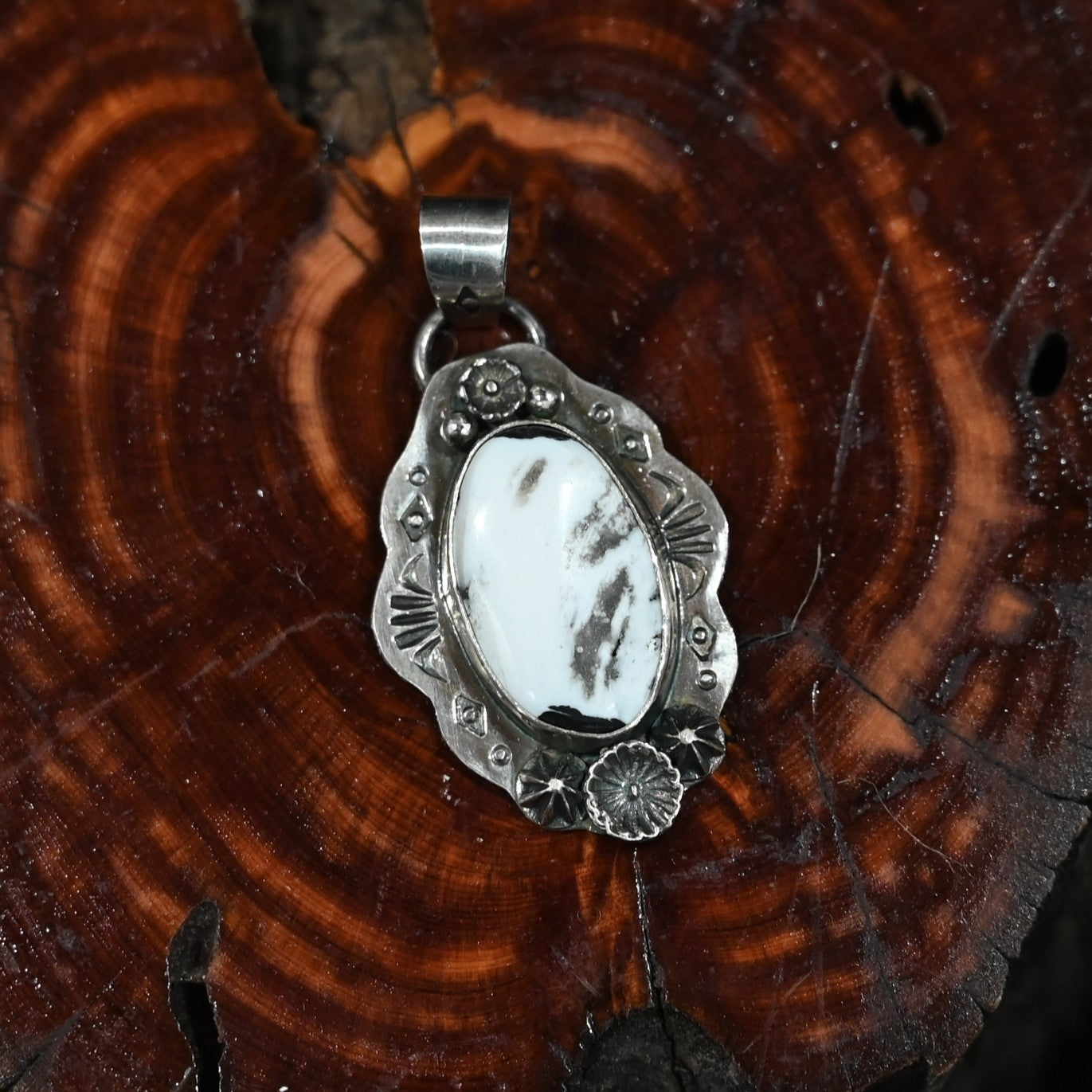 Calico Rose sterling silver pendant with White Buffalo turquoise stone featuring bold black-and-white veining