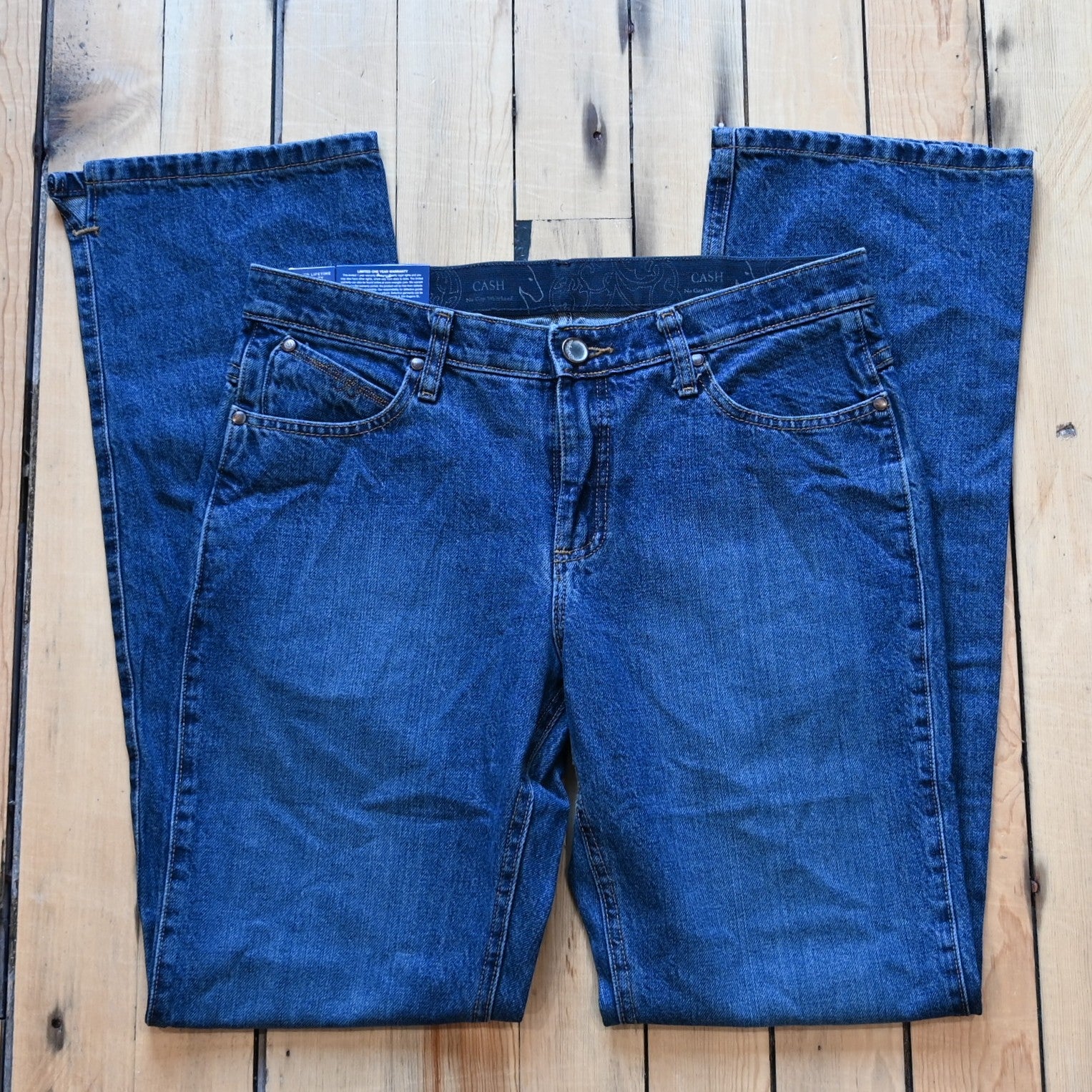 View of Wrangler Ultimate Riding Jean – Cash Fit in American Spirit wash with boot cut leg