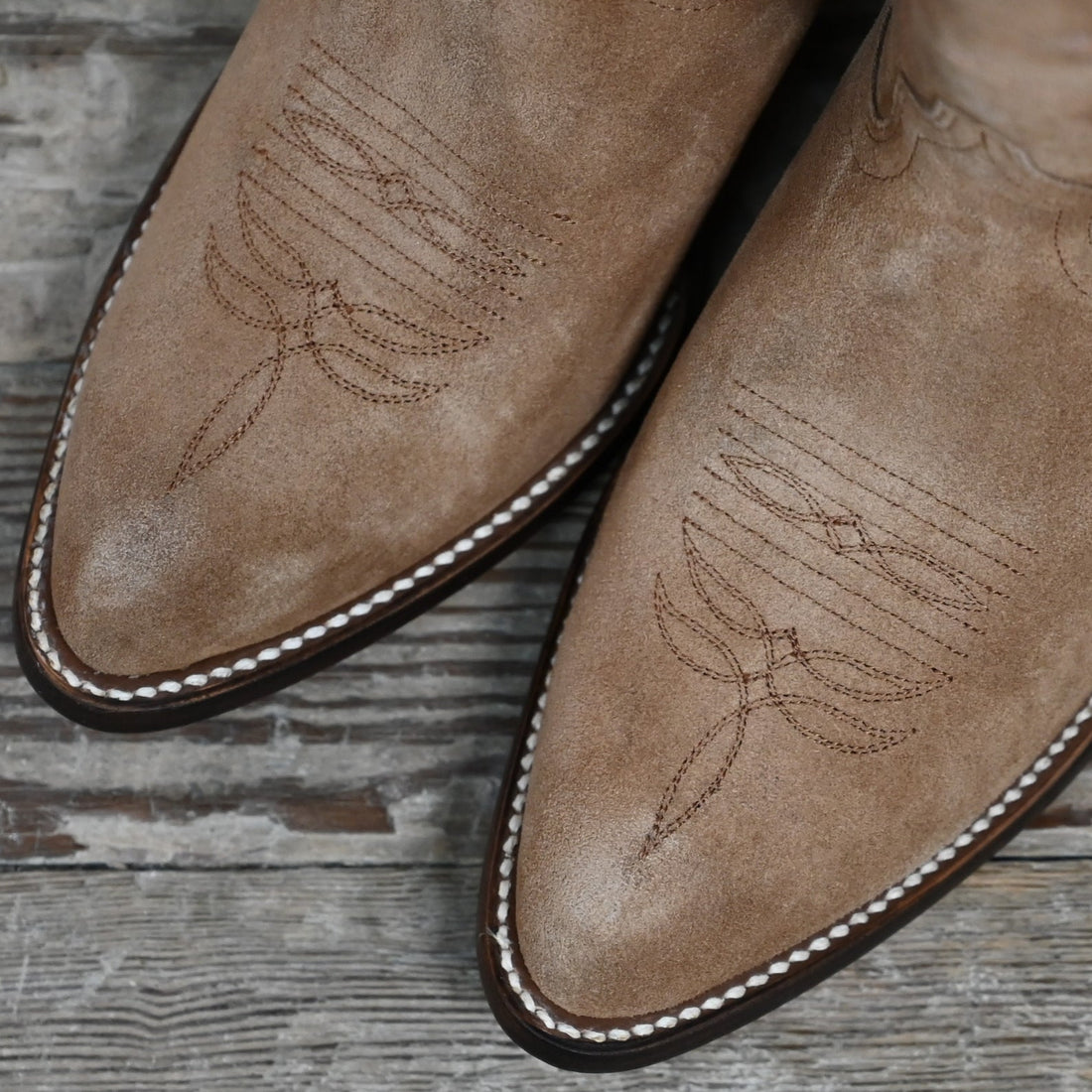 View of Macie Bean 15″ “Mind Your Own Biscuits” tobacco suede boot with almond toe and decorative stitch