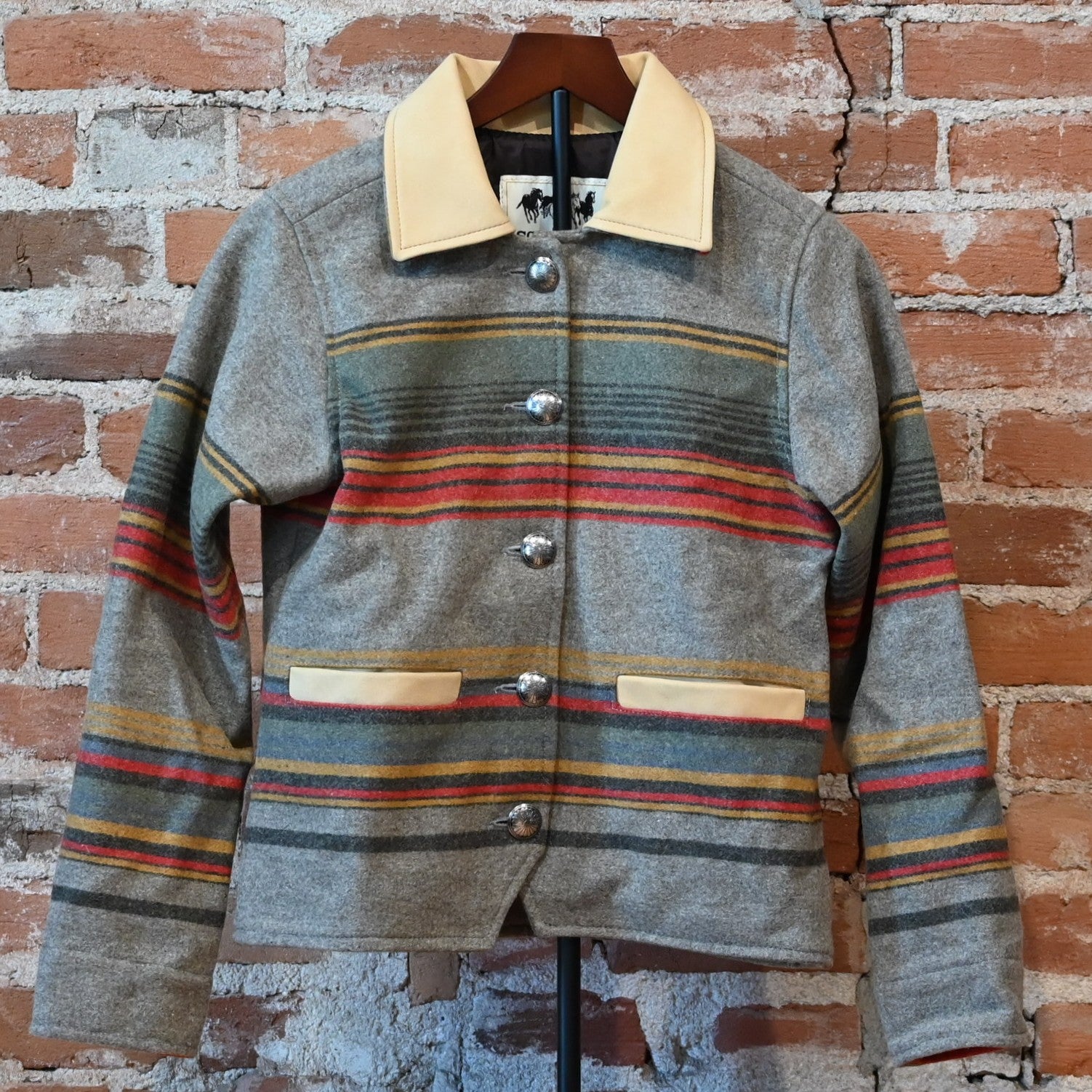 Schaefer Outfitter Ladies Las Cruces Jacket in taupe stripe wool with lamb suede collar and concho buttons