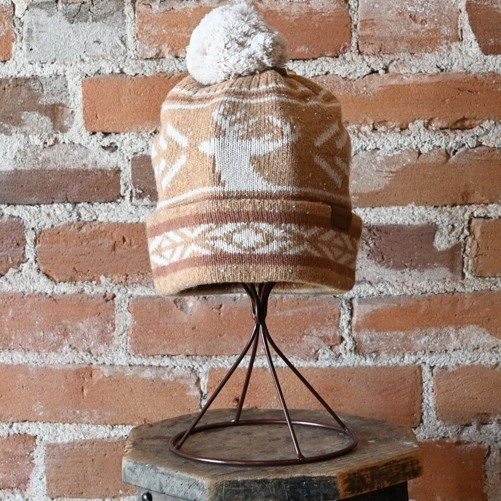 Pendleton Icon Pom Beanie in tan wool blend with elk winter print, fold-over brim, and pom top.