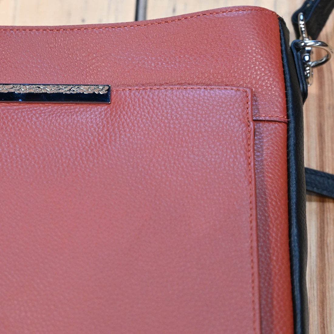 Gun Toten Mamas conceal carry Slim Cross-Body bag in cinnamon leather with black trim