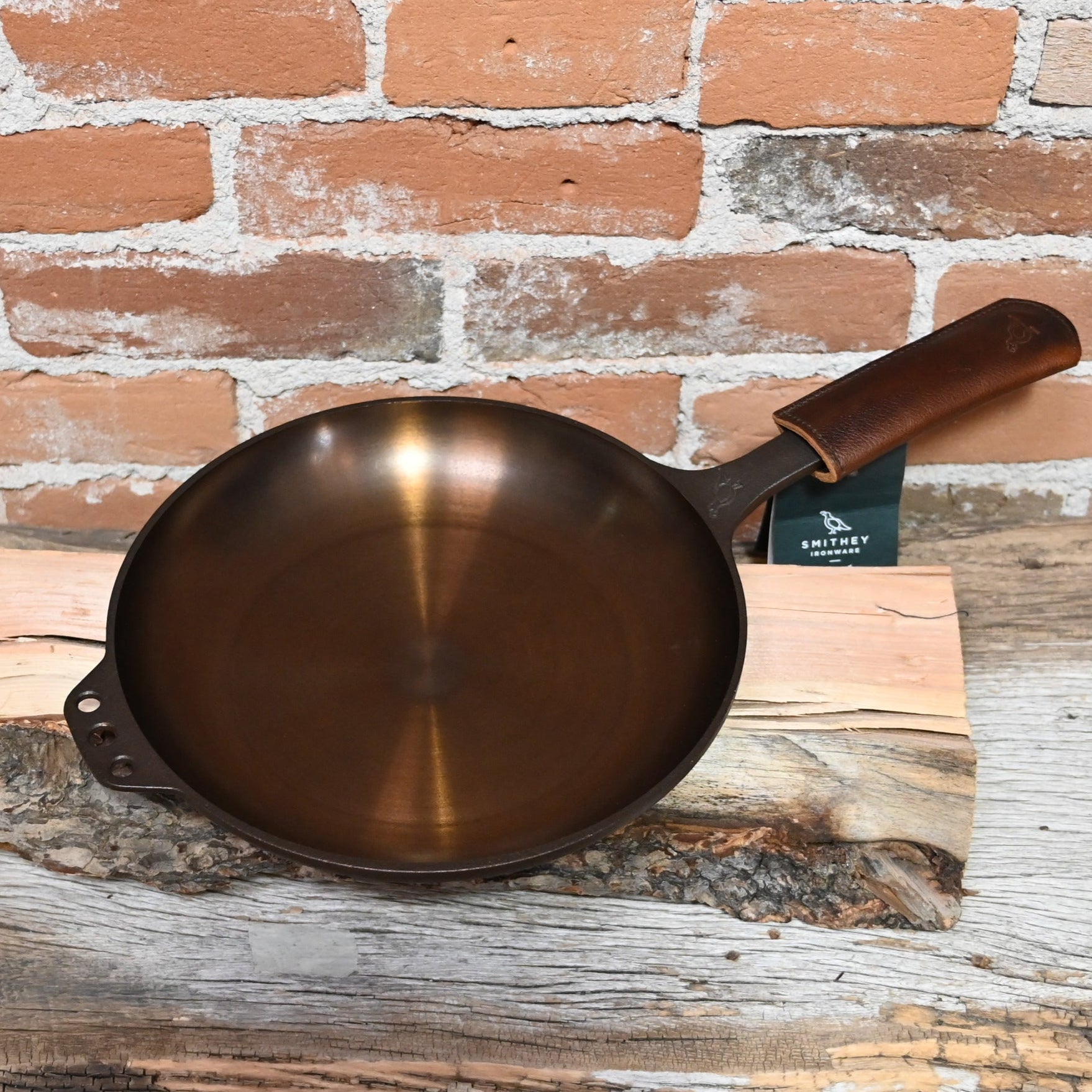 View of Smithey Ironware No. 10 Cast Iron Chef Skillet with polished interior and ergonomic handle