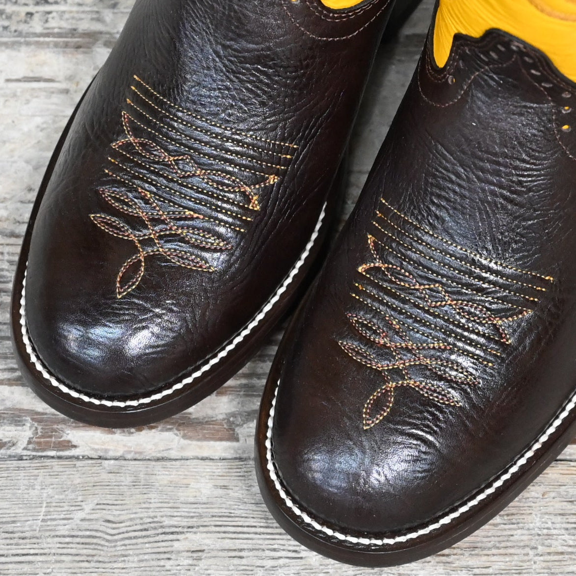 View of Hondo 13" cowboy boot with yellow top, chocolate shoulder vamp, and wide round toe