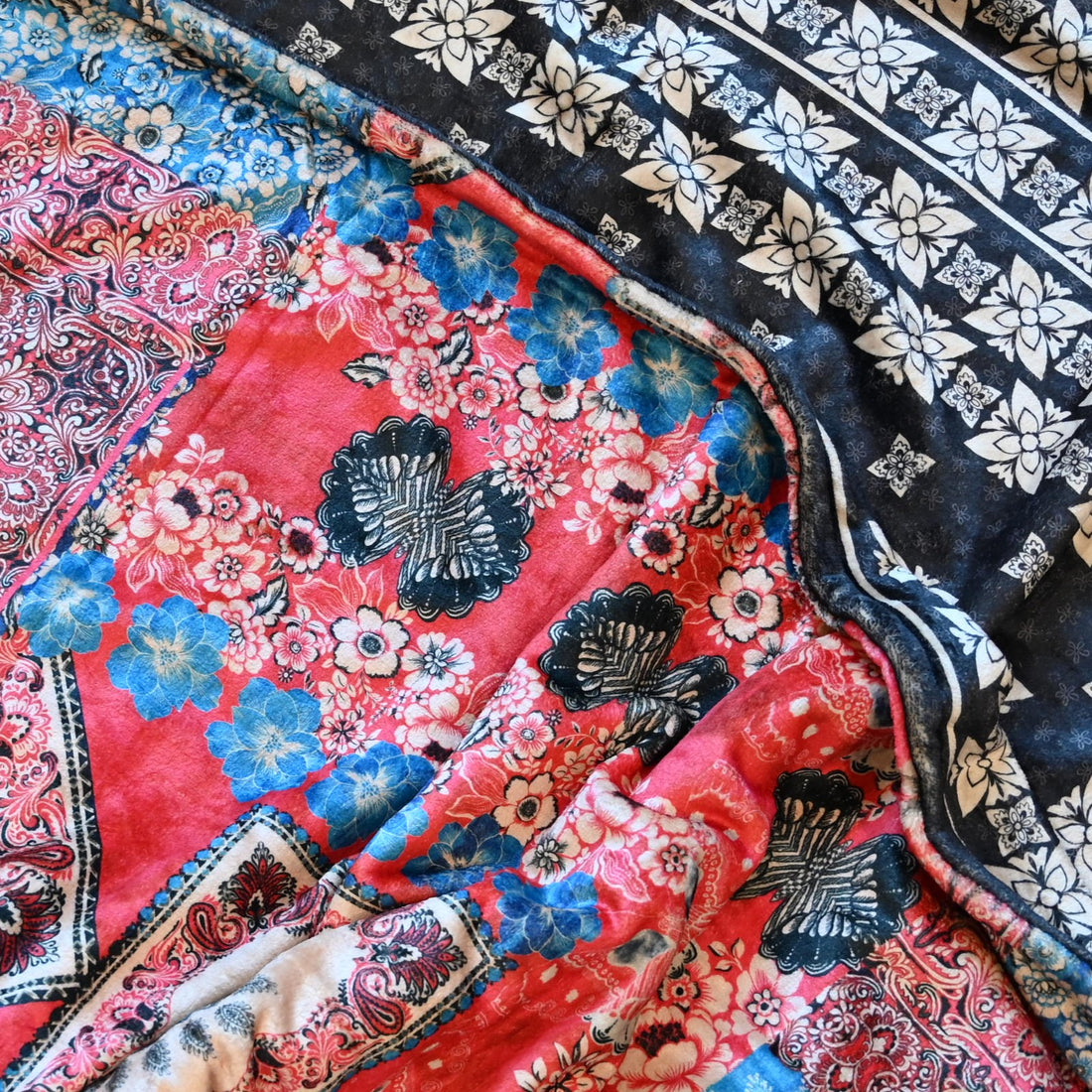 View of Johnny Was Laurel Canyon Cozy Blanket in Myna Scarf Print with tassel pouch