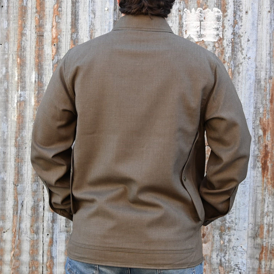 View of Filson Forestry Cloth Cruiser Jacket featuring four front cargo pockets and snap-front closure