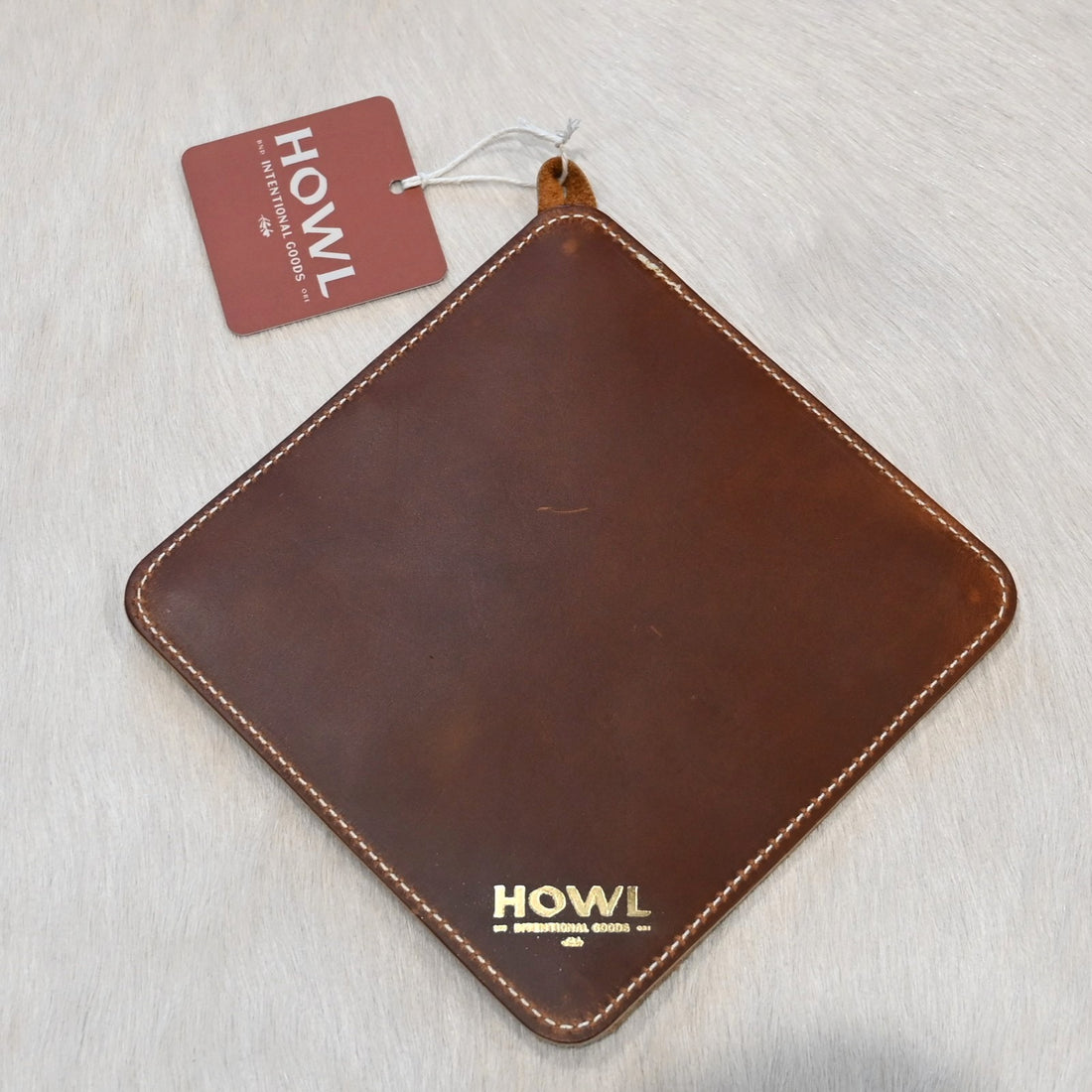 Howl Intentional Goods PanHandler trivet in caramel leather with Pendleton wool inlay