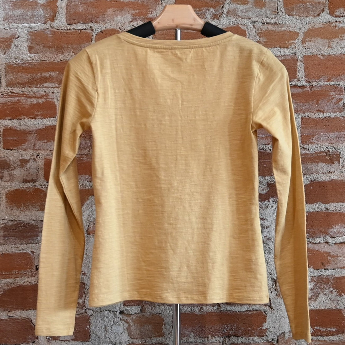 View of Pale gold Pendleton Henley tee with long sleeves and button placket