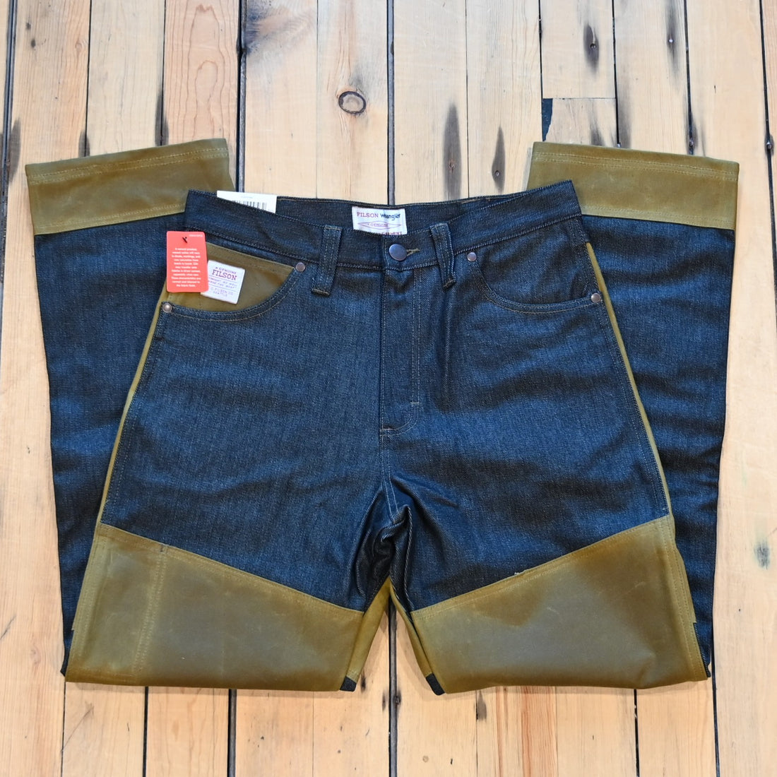 Filson × Wrangler Two-Tone Adventure Jean in indigo with tan waxed canvas reinforcements