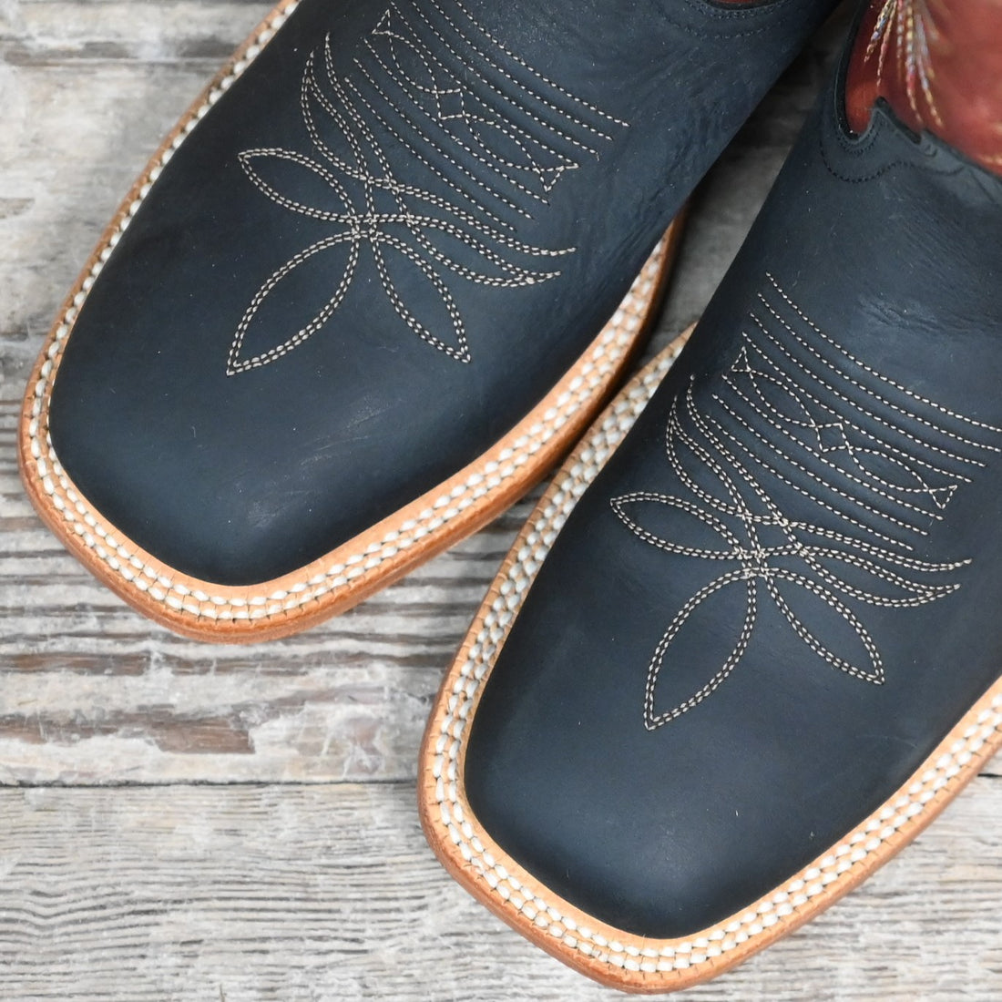 View of Hyer CHERRYVALE 13" boots showcasing cognac Garrison goat leather upper and black mule cowhide vamp with broad square toe and Stockman block heel