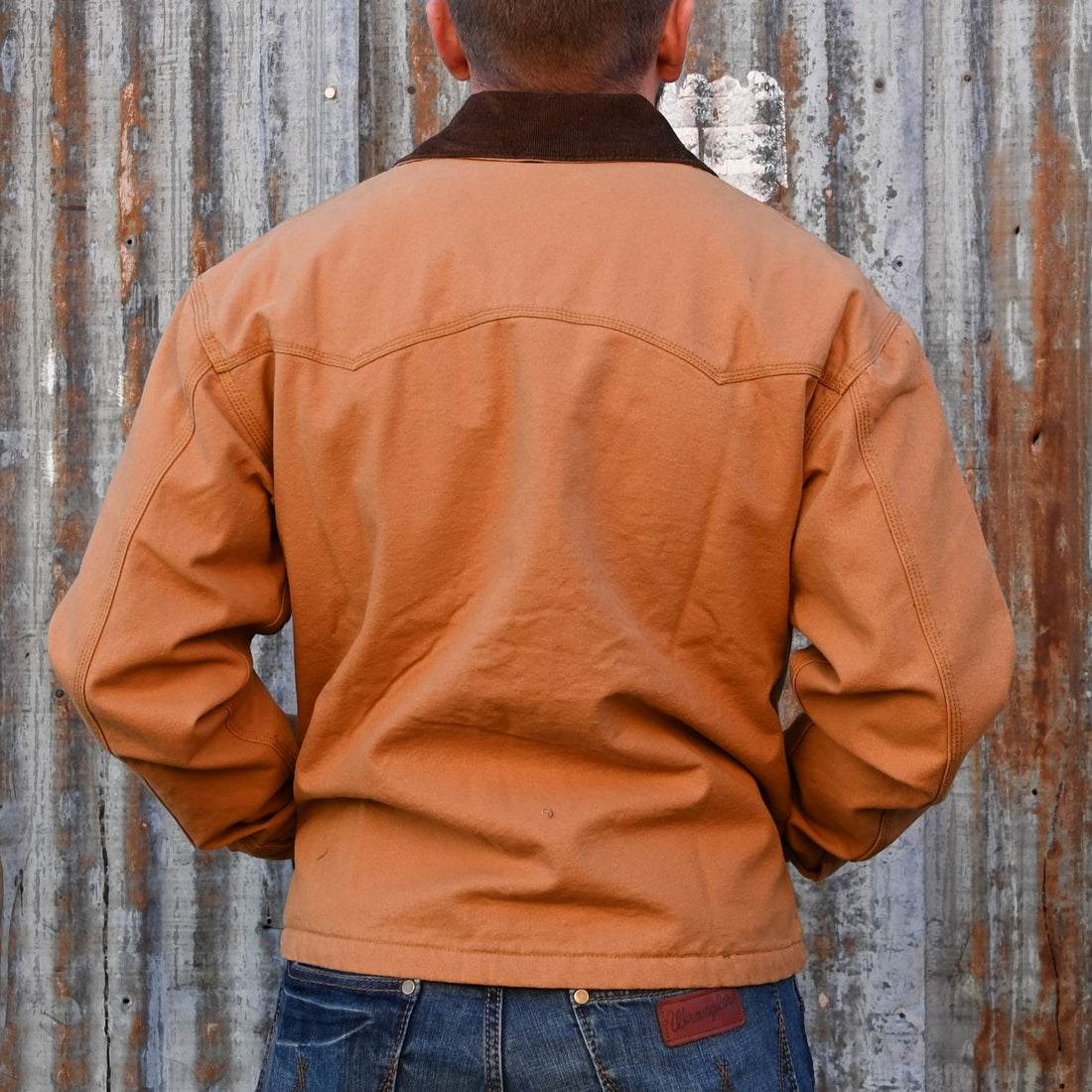View of Schaefer saddle‑tan brush jacket with fleece blanket lining, corduroy collar, and six front pockets