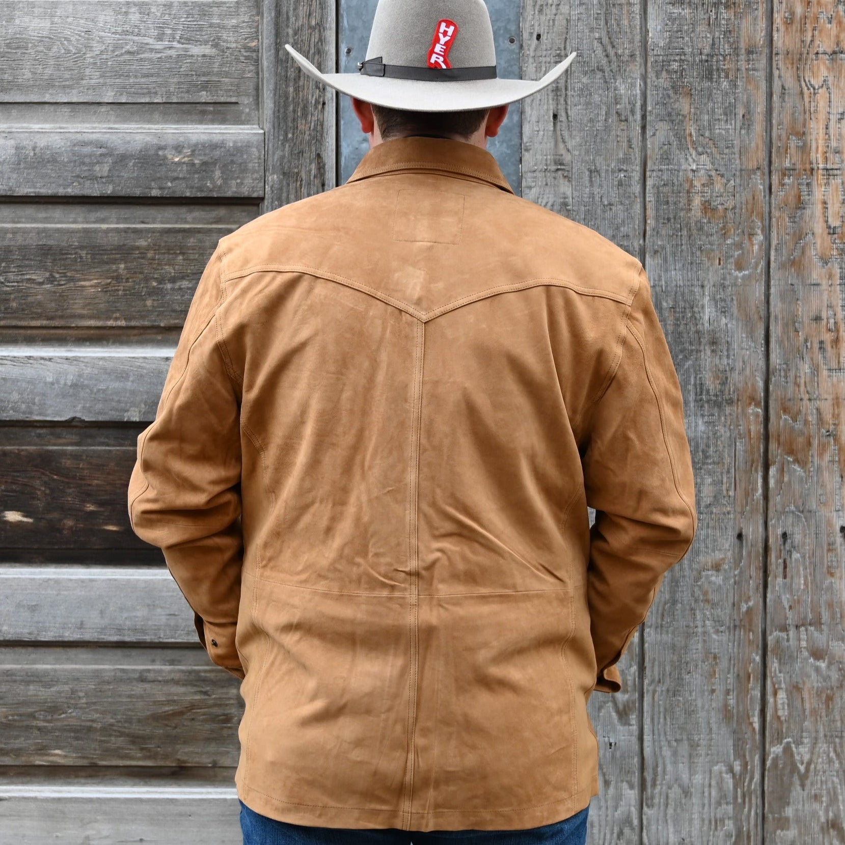 View of Schaefer tan goat suede overshirt with snap front, chest pockets, and hand-warmer pockets