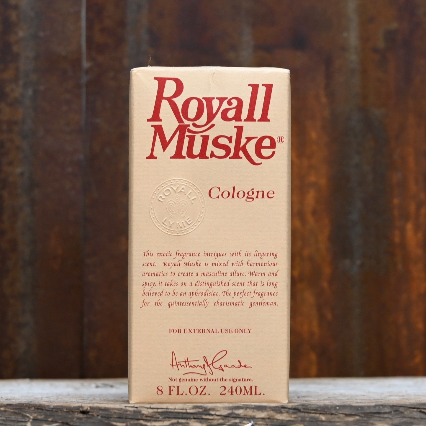Royall Muske 8 oz bottle of all-purpose lotion and splash cologne in classic tan glass with gold cap