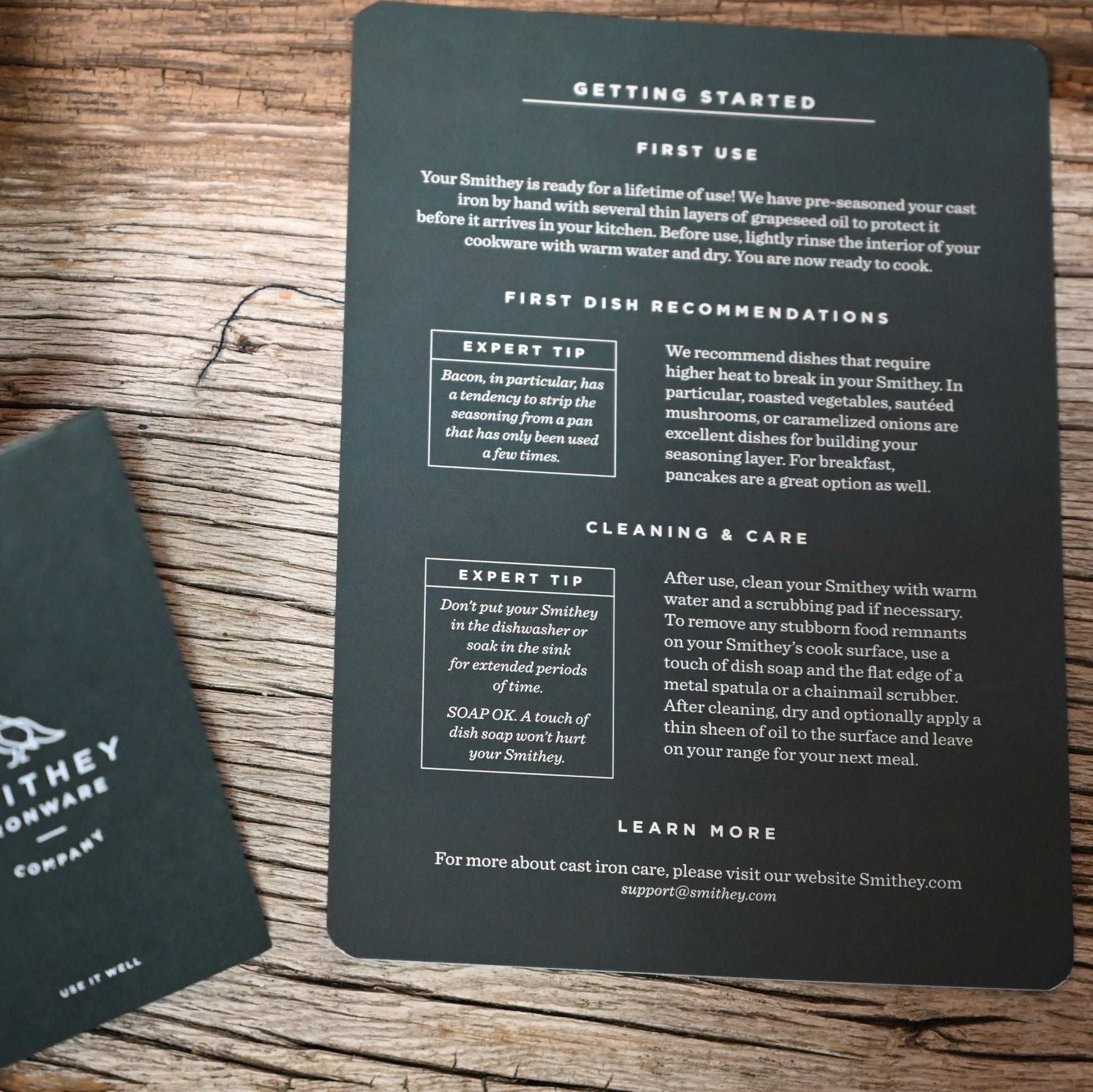 View of Smithey Ironware 5.5 qt Dutch Oven with polished interior and ergonomic handles