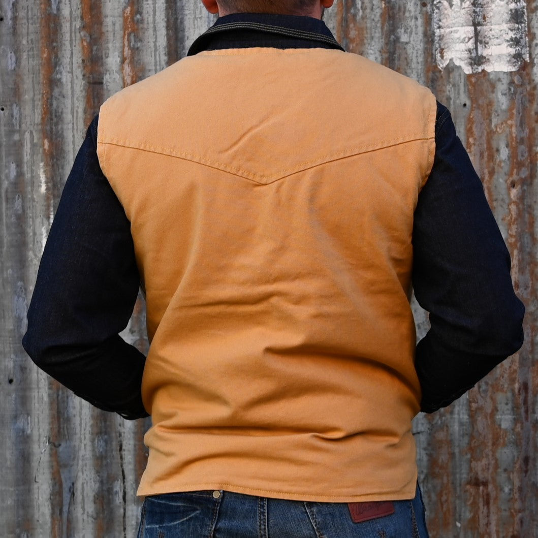 View of Schaefer sherpa-lined canvas vest in suntan with drop-tail hem and five-pocket front