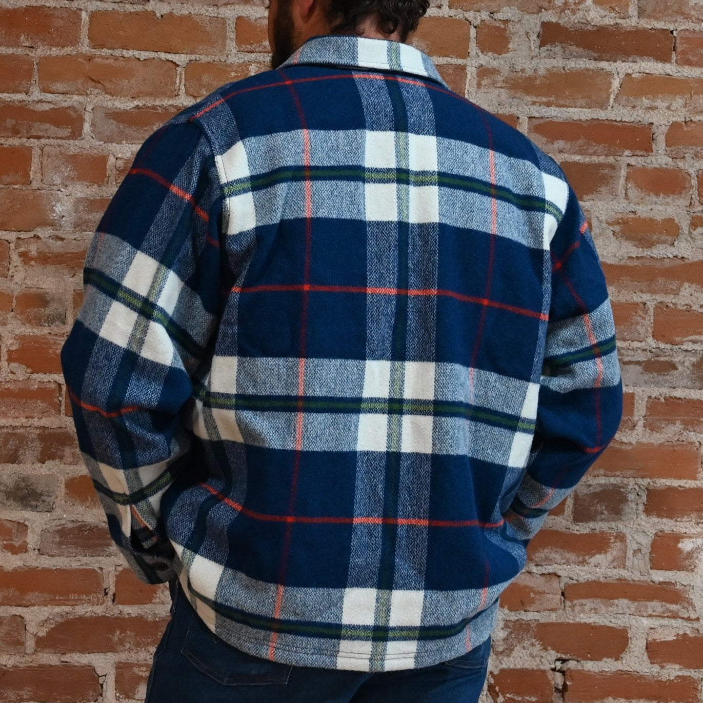 View of Filson Jac-Shirt featuring flap-covered chest pockets and straight hem