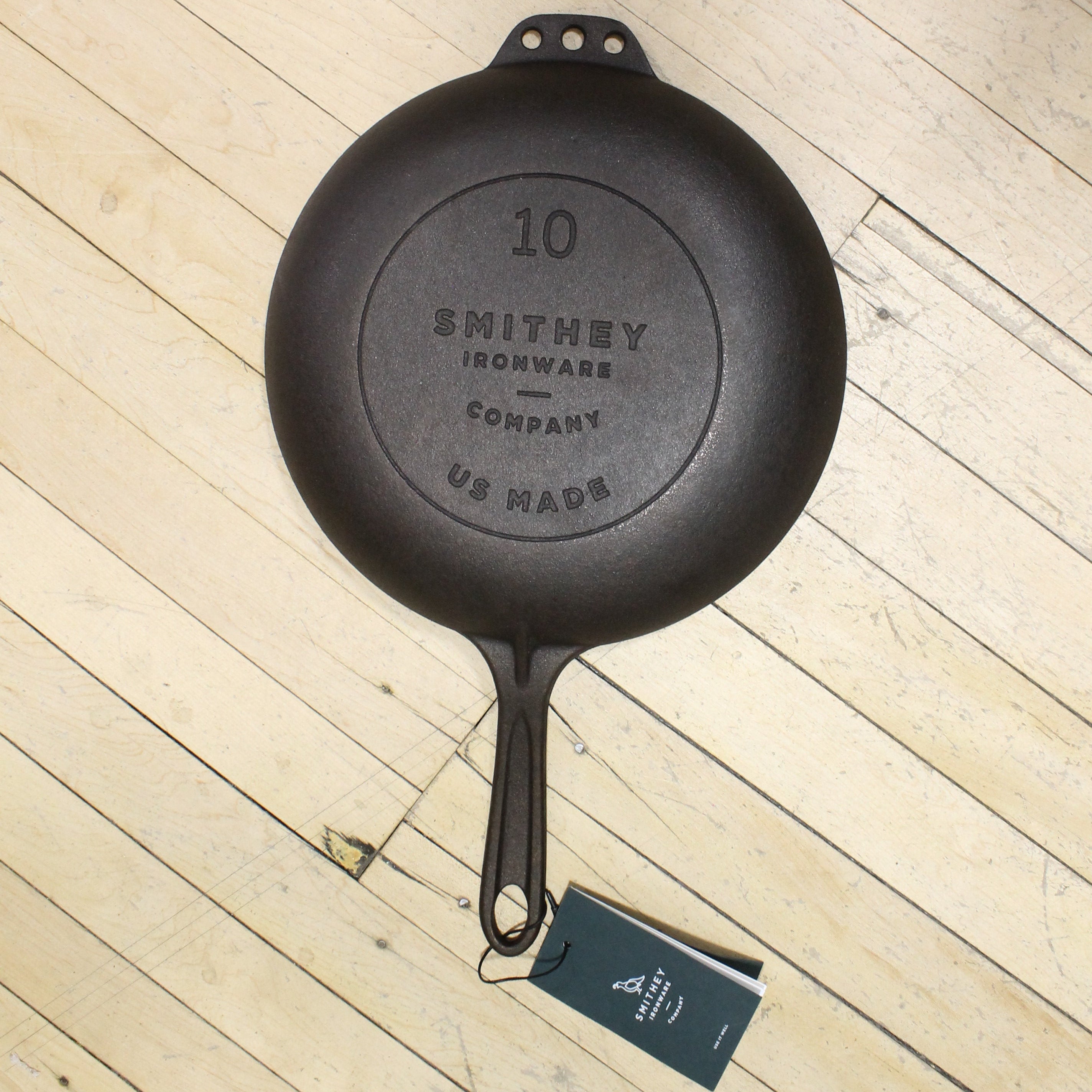 View of Smithey Ironware No. 10 Cast Iron Chef Skillet with polished interior and ergonomic handle