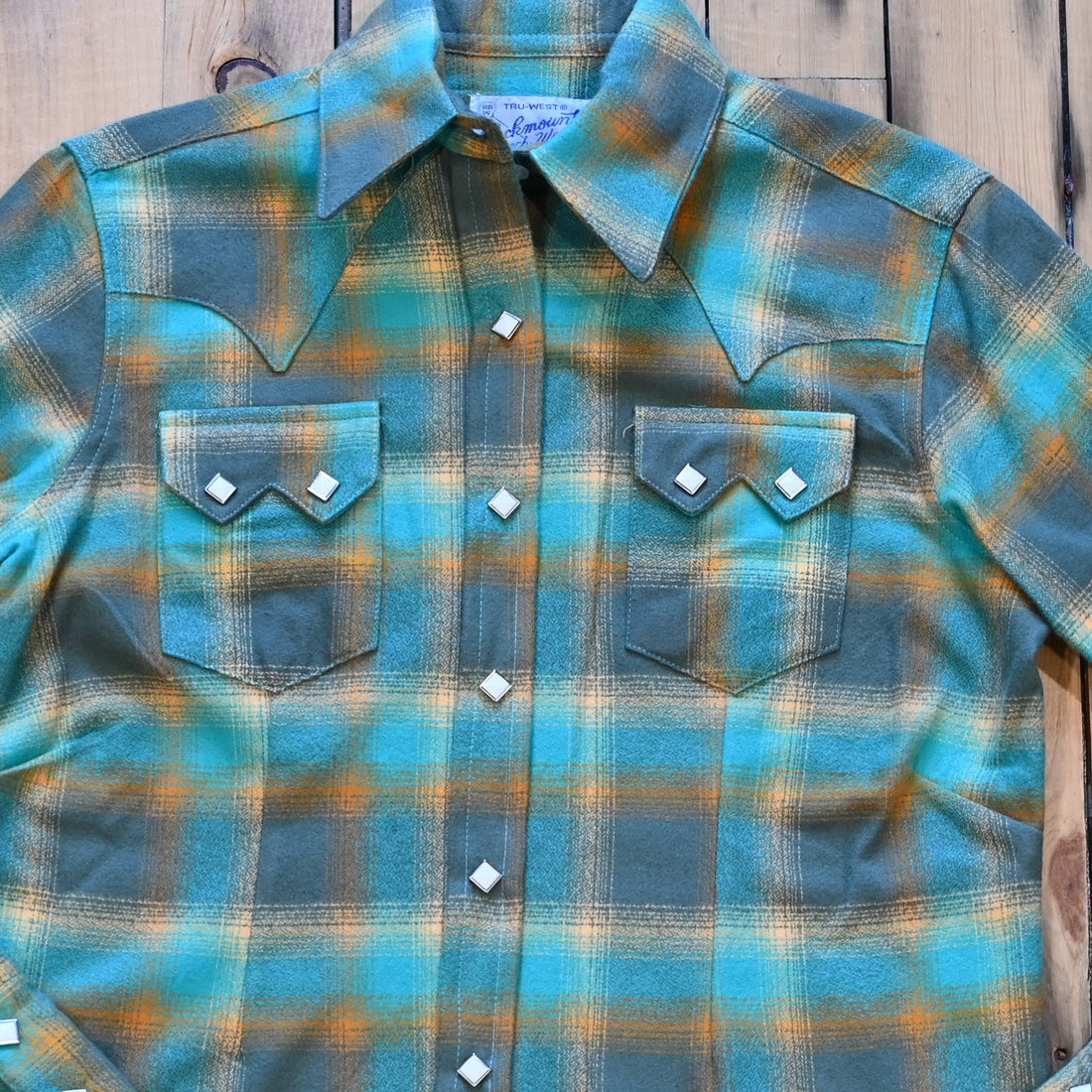 Ladies plush green and turquoise plaid flannel Western shirt with sawtooth pockets and diamond snaps