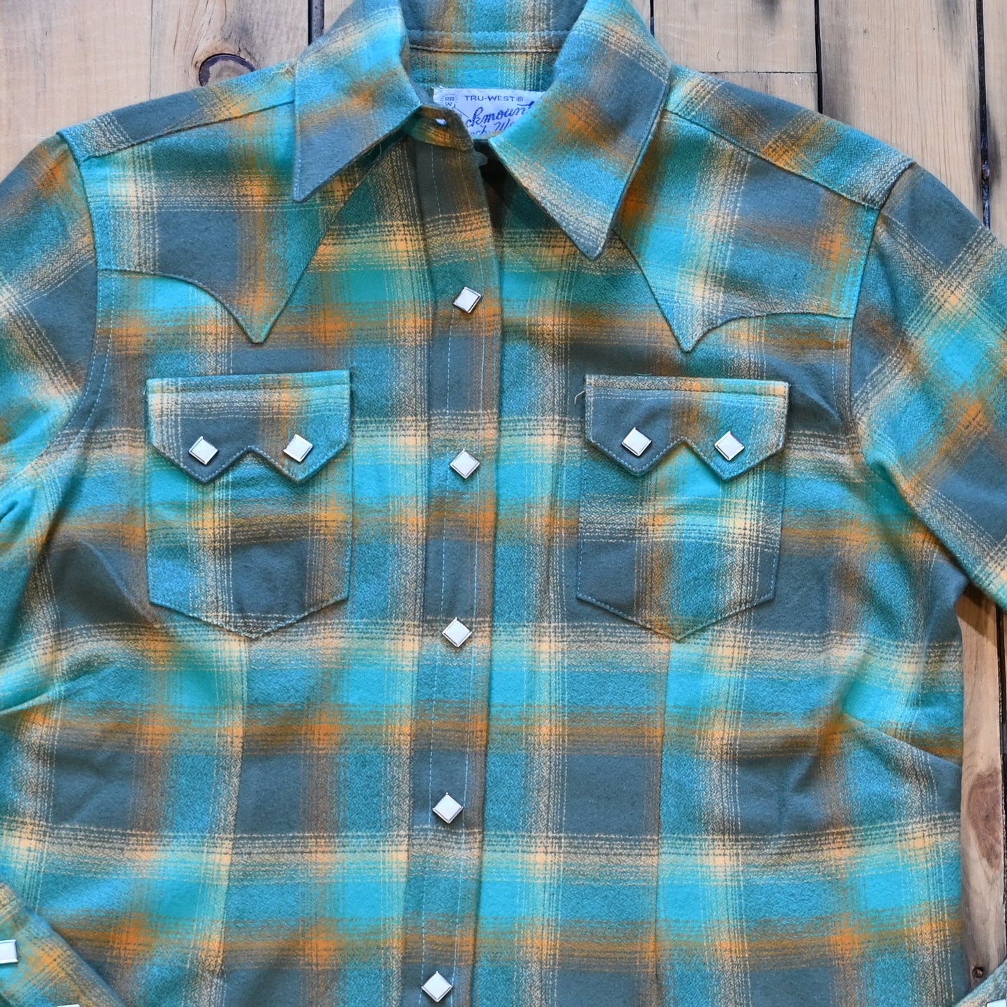 Ladies plush green and turquoise plaid flannel Western shirt with sawtooth pockets and diamond snaps