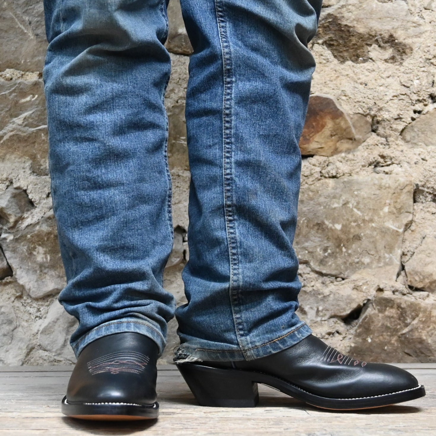 View of Hondo 16" cowboy boot with purple top, black retan vamp, pull holes, and spur ledge