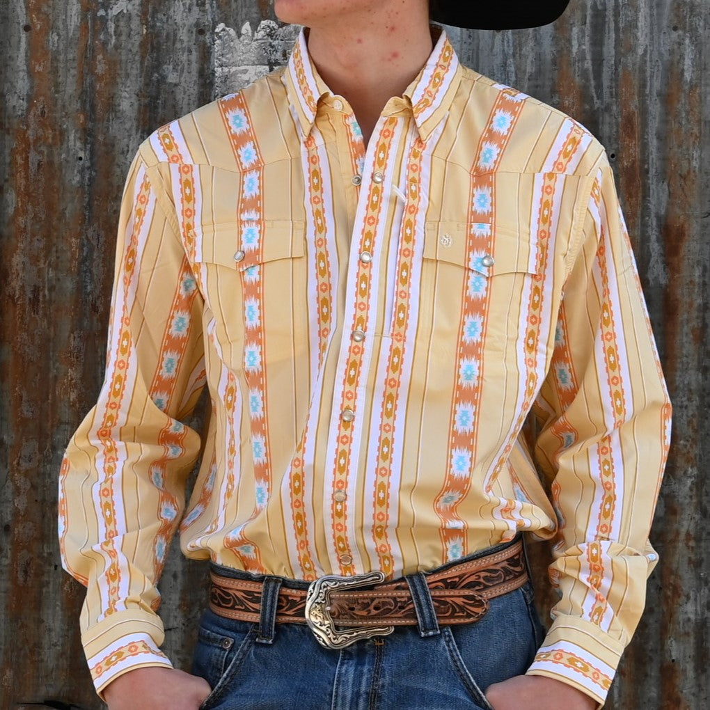View of Snakeback Western snap shirt with orange and yellow Southwest print and mesh yoke vent