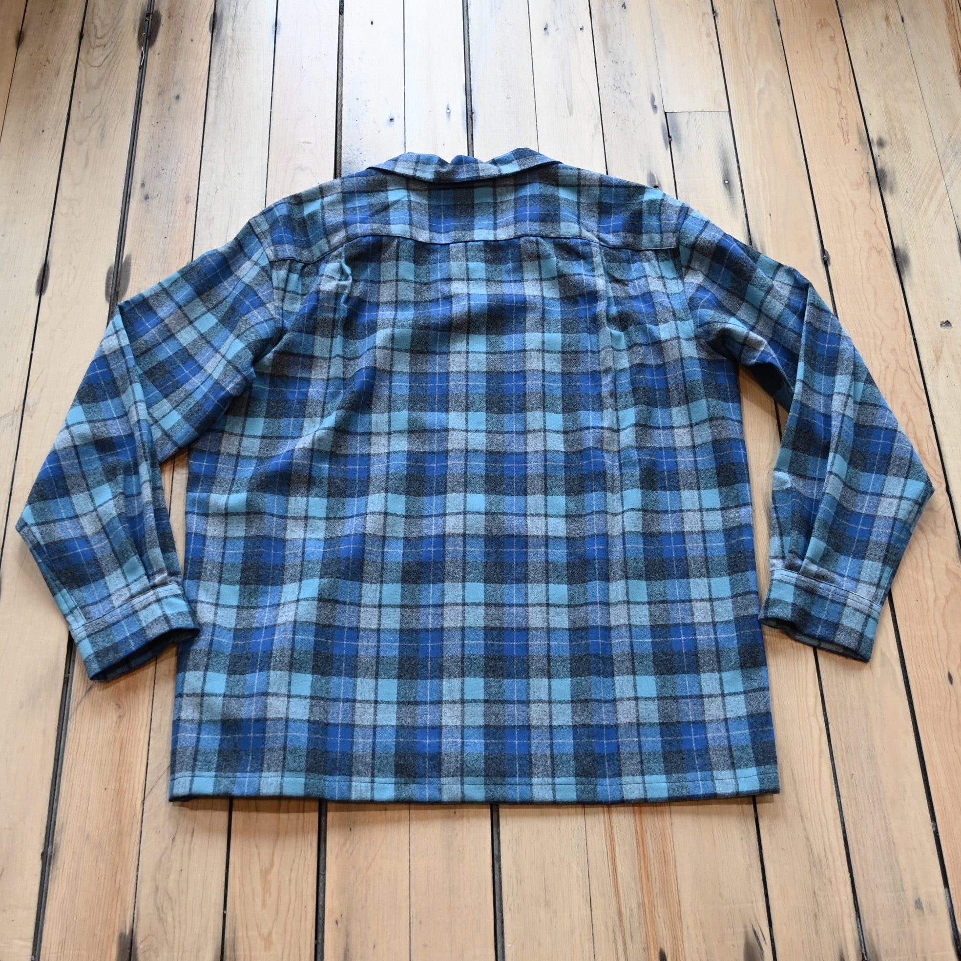 View of Pendleton men’s wool board shirt in Blue Original Soft Plaid with square hem and flap chest pockets