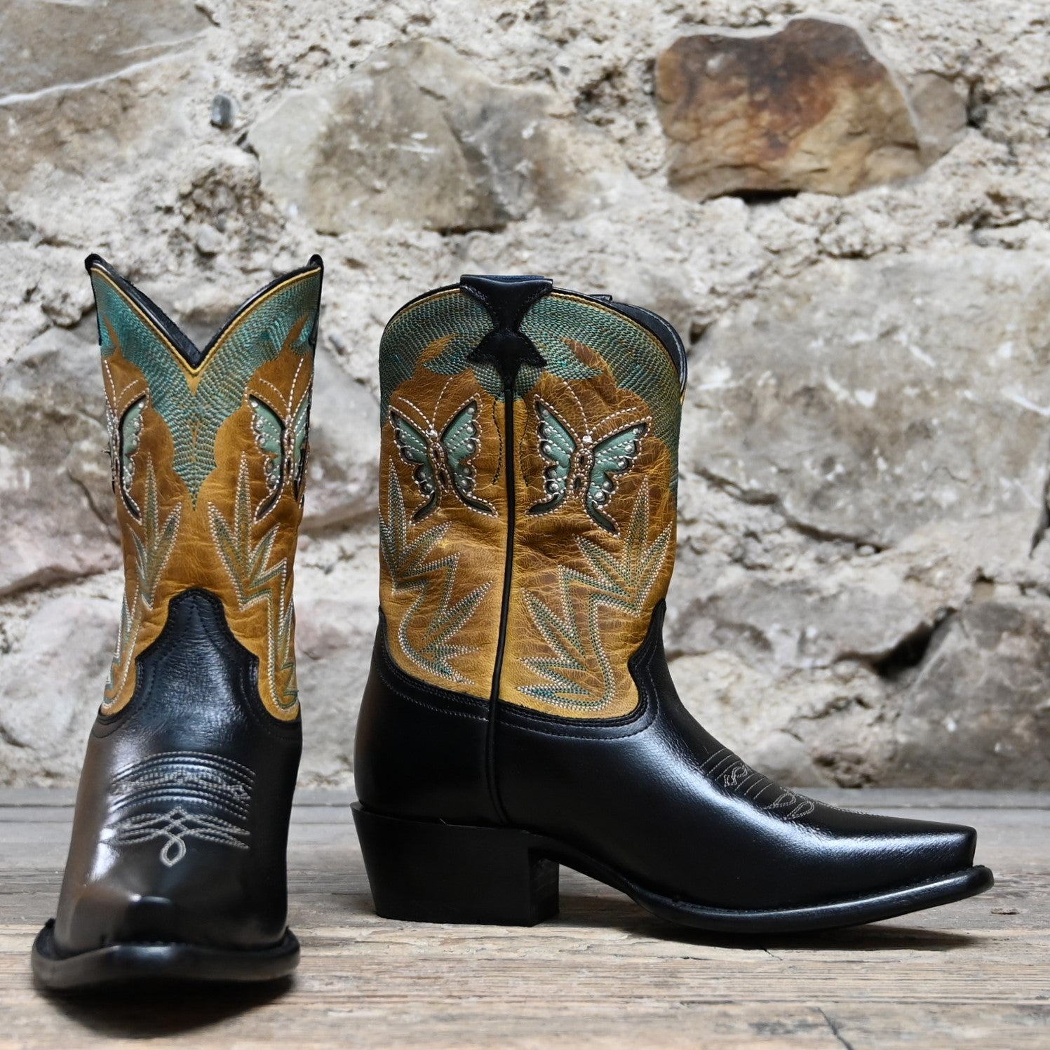 View of Hyer NANETTE 9&quot; boots showcasing black cowhide vamp and sunflower vintage goat top with butterfly inlay, fashion snip toe, and leather stacked heel