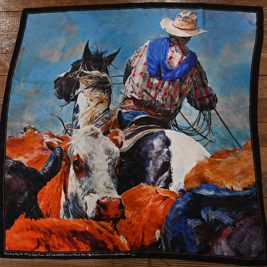 Limited-edition silk scarf featuring “Branding Day” design by Sophy Brown with hand-rolled hem