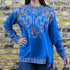 View of Johnny Was Sundae Tunic in Mediterranean Blue with floral embroidery and henley neckline
