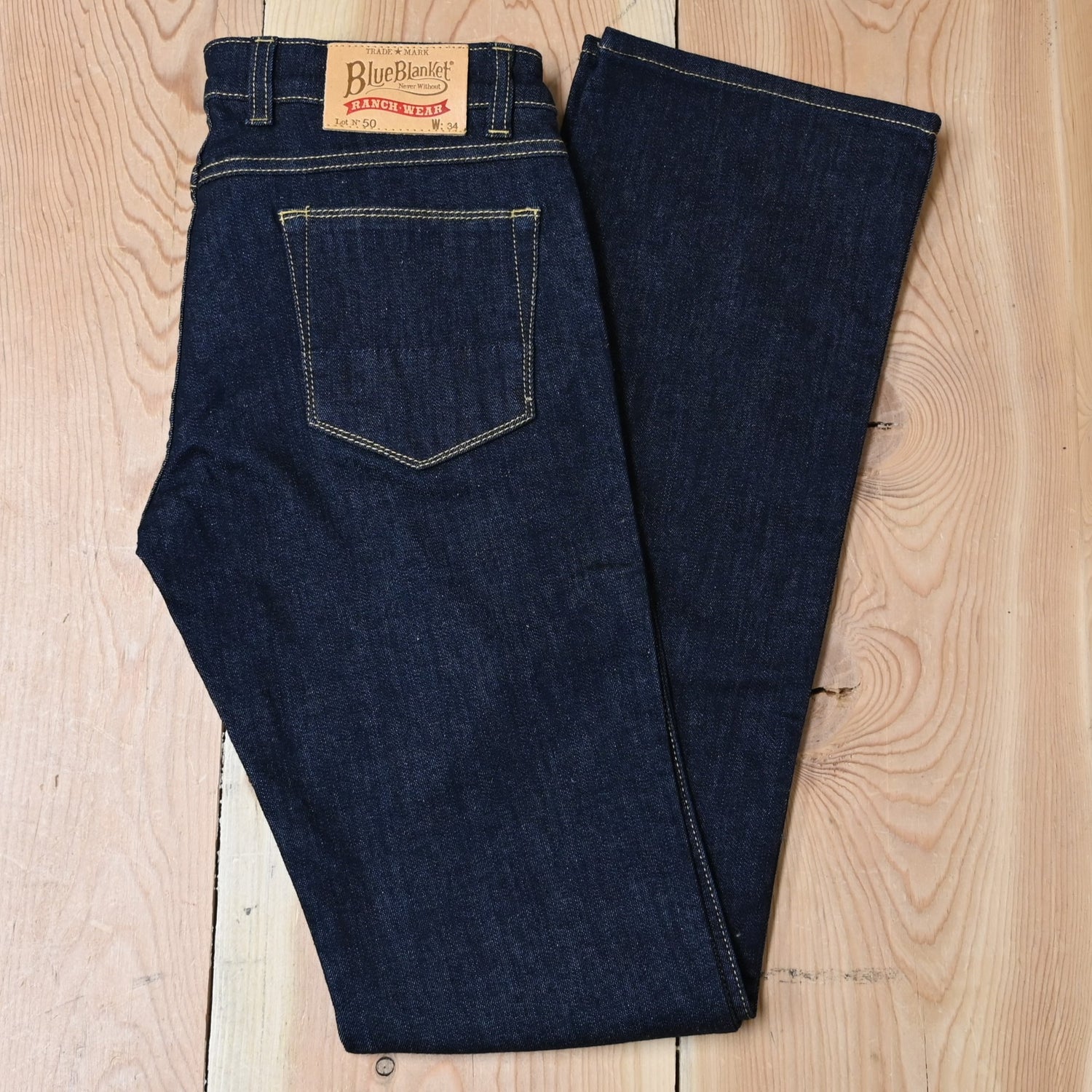 View of Blue Blanket ladies dark indigo denim jeans with straight-leg and tailored waist